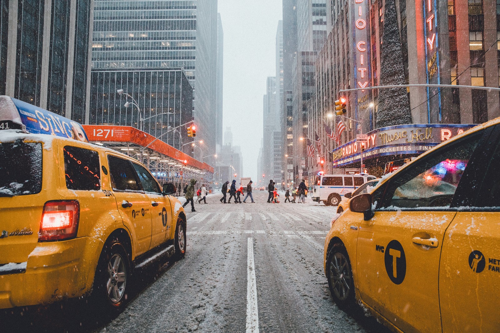 Yellow Taxis on a Snowy New York City Street HD Wallpaper