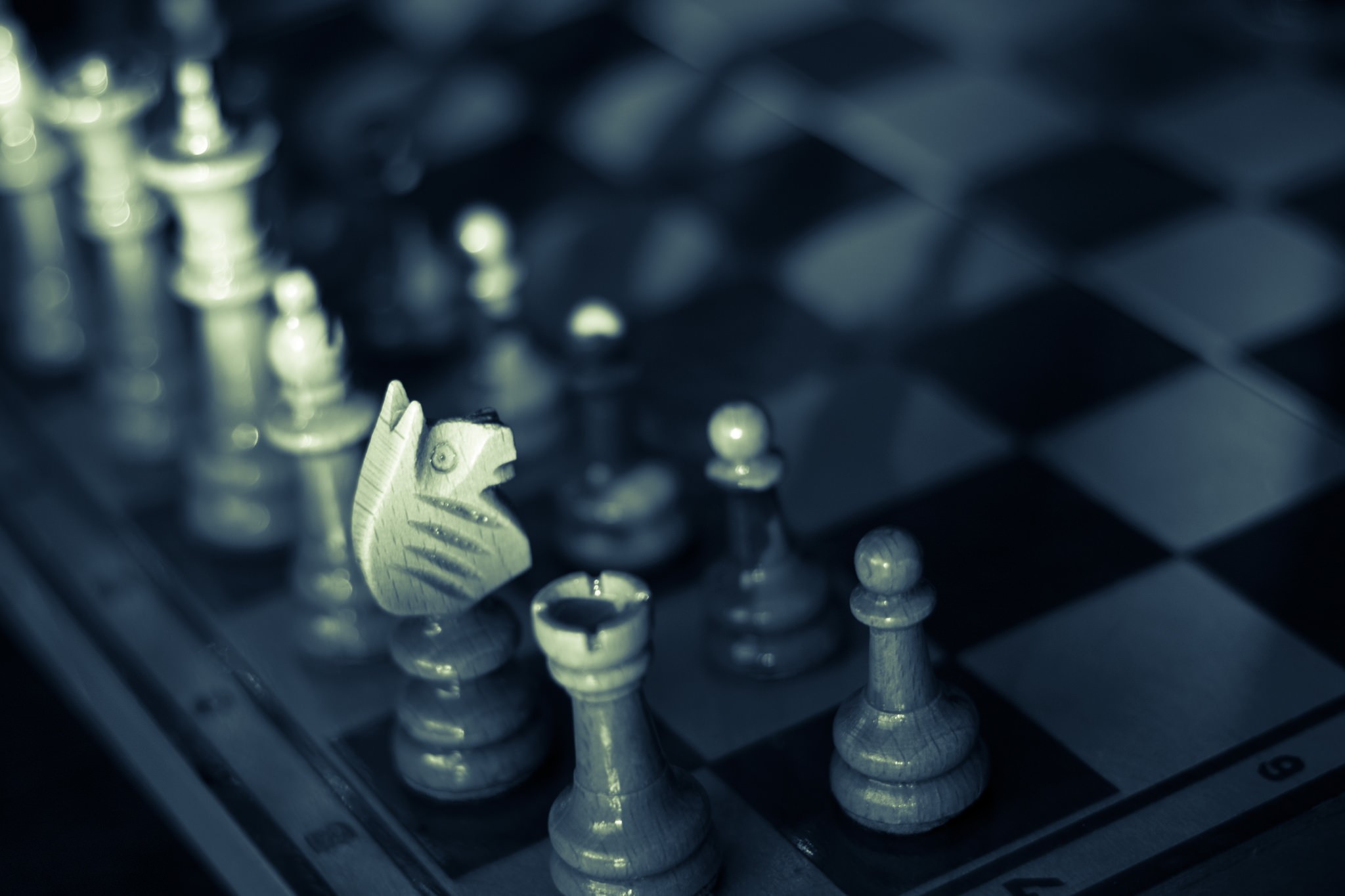 Chess pieces on a board with shallow depth of field HD Wallpaper