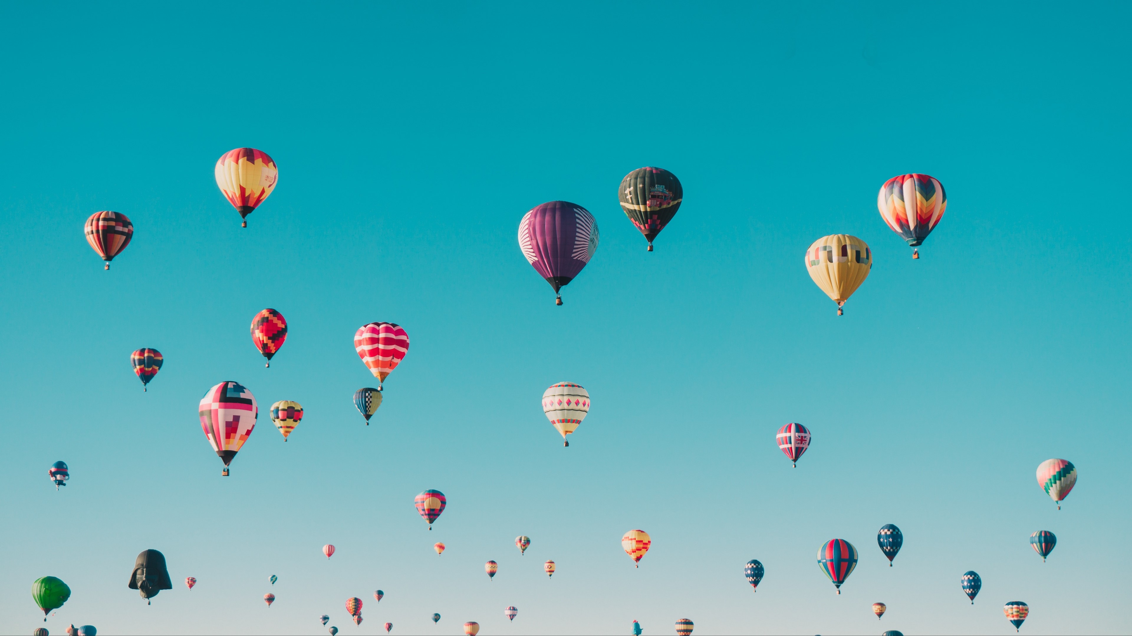Hot air balloons in a clear blue sky HD Wallpaper