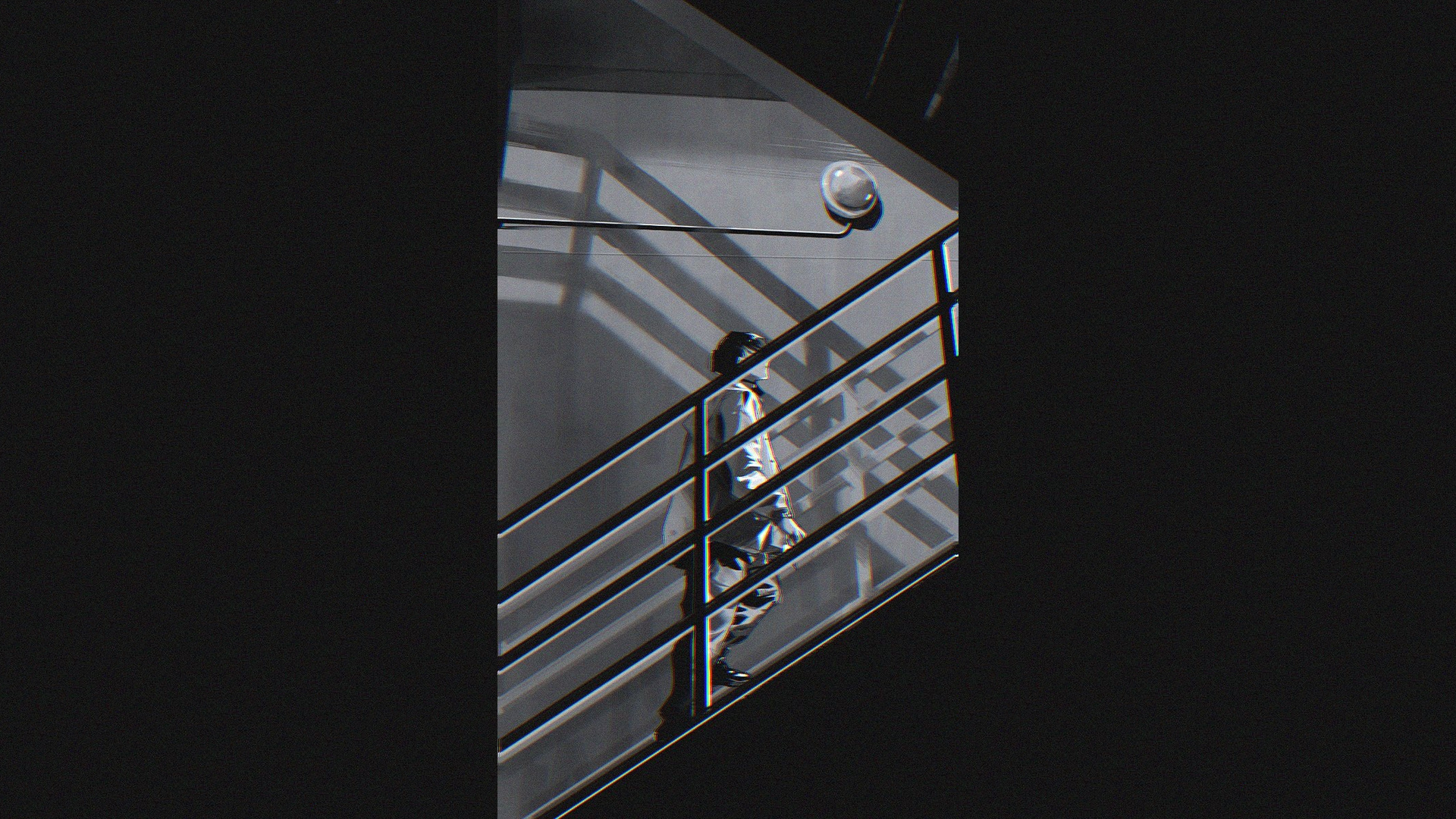 Man walking up stairs in monochrome HD Wallpaper