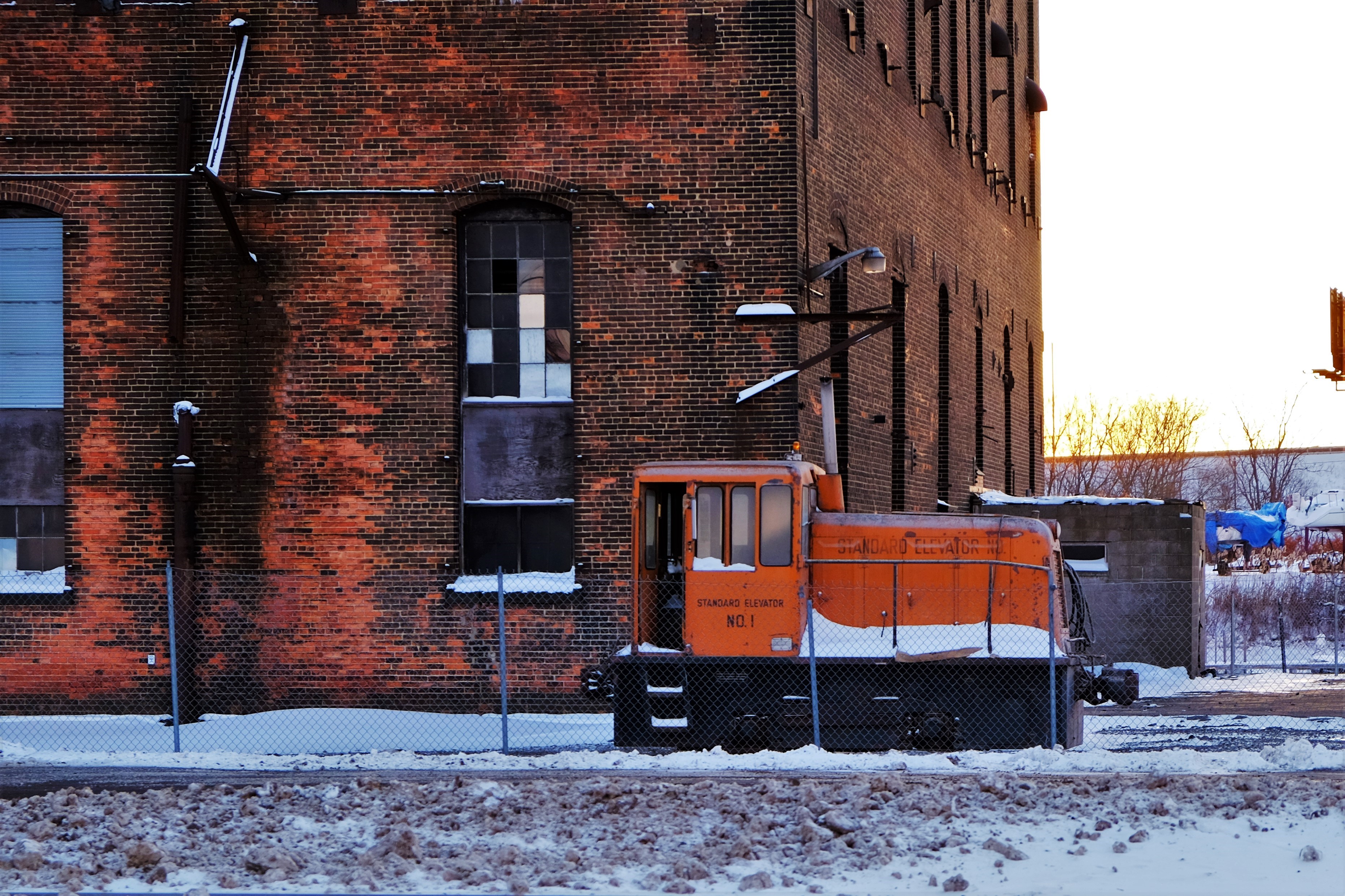 Orange locomotive at Standard Elevator No. 1 in winter HD Wallpaper
