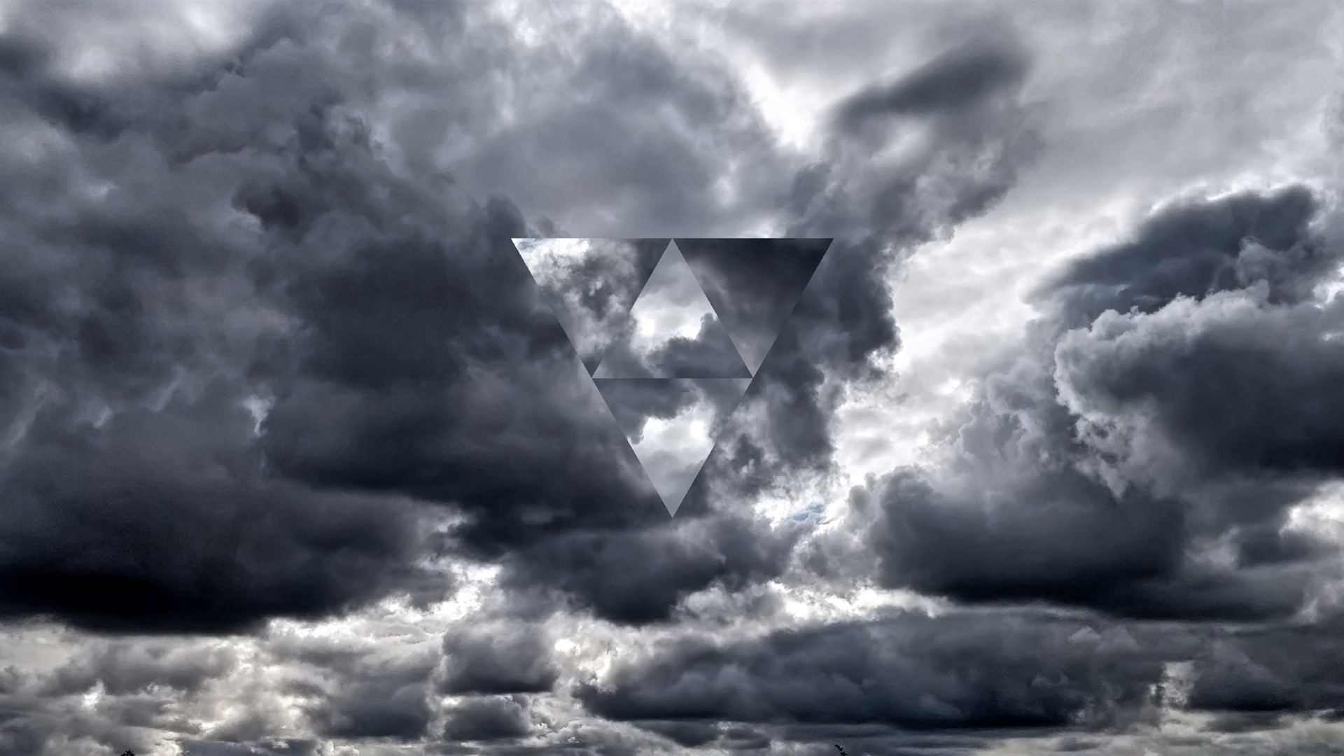 Dark clouds with a geometric triangle overlay HD Wallpaper