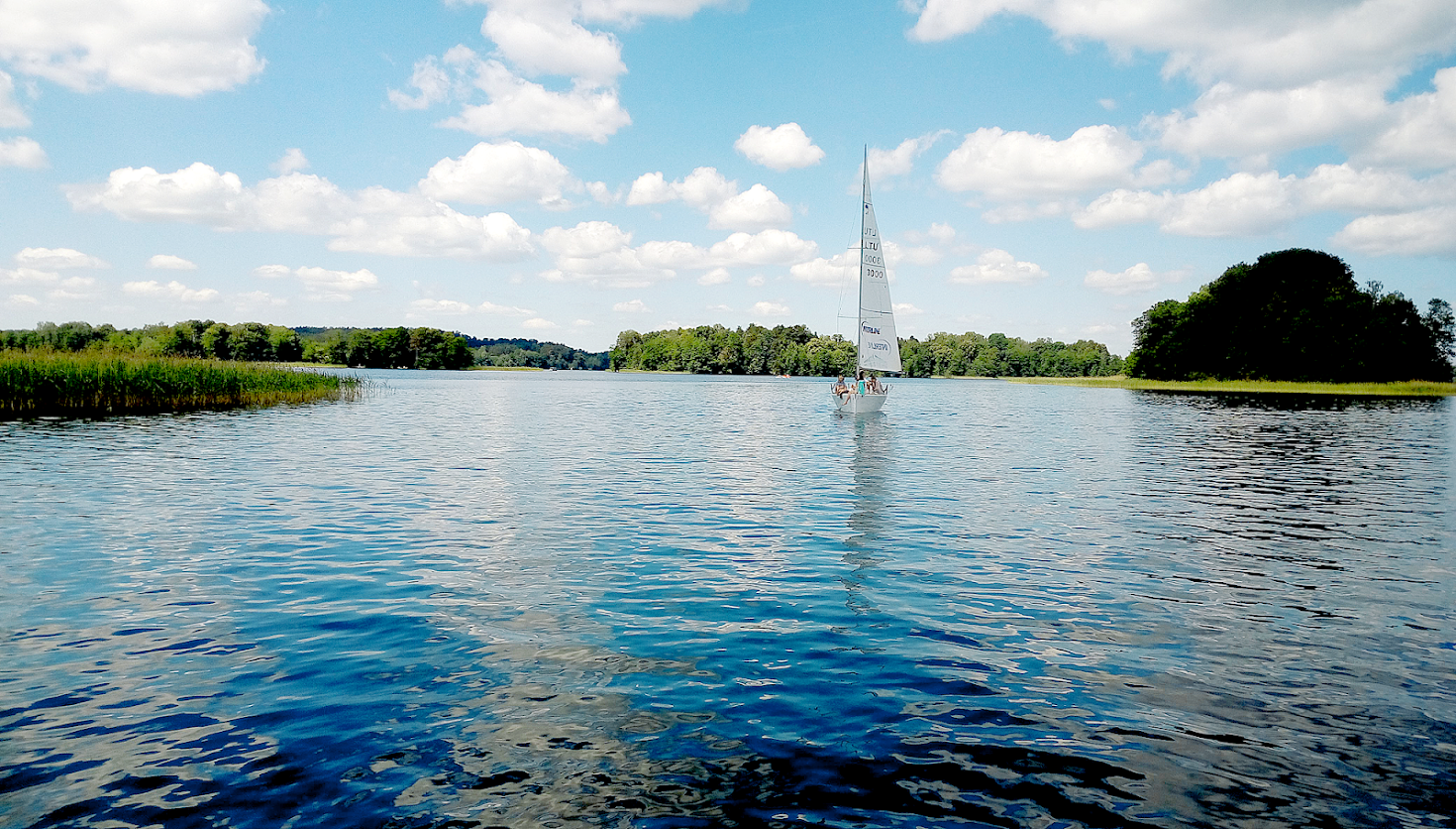 Sailboat on a lake with trees and clouds HD Wallpaper
