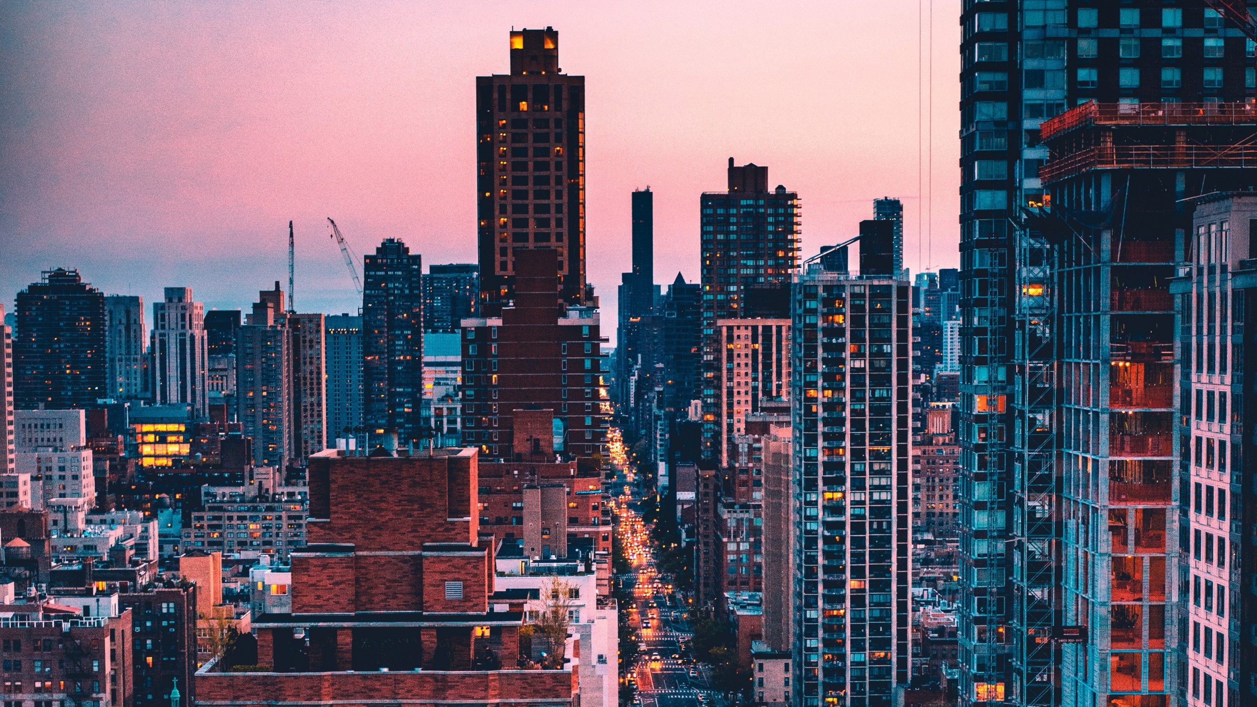 New York City skyscrapers at sunset with street lights HD Wallpaper
