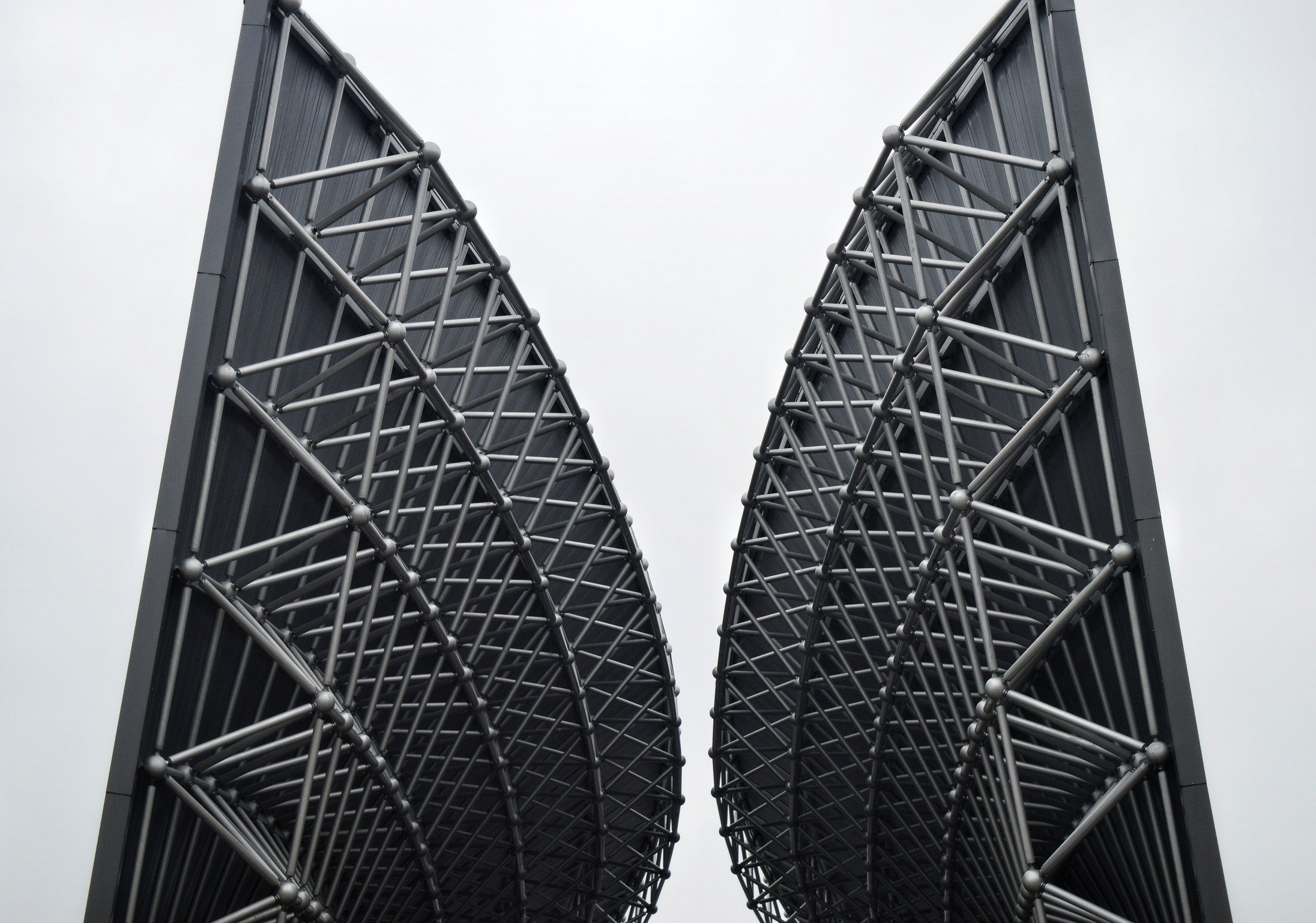 Modern architectural structure with geometric metal framework HD Wallpaper