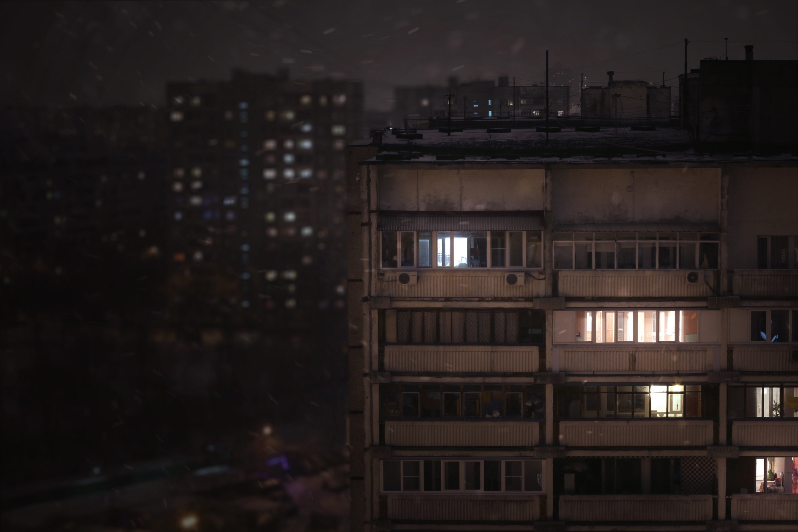 Apartment buildings at night with snow HD Wallpaper