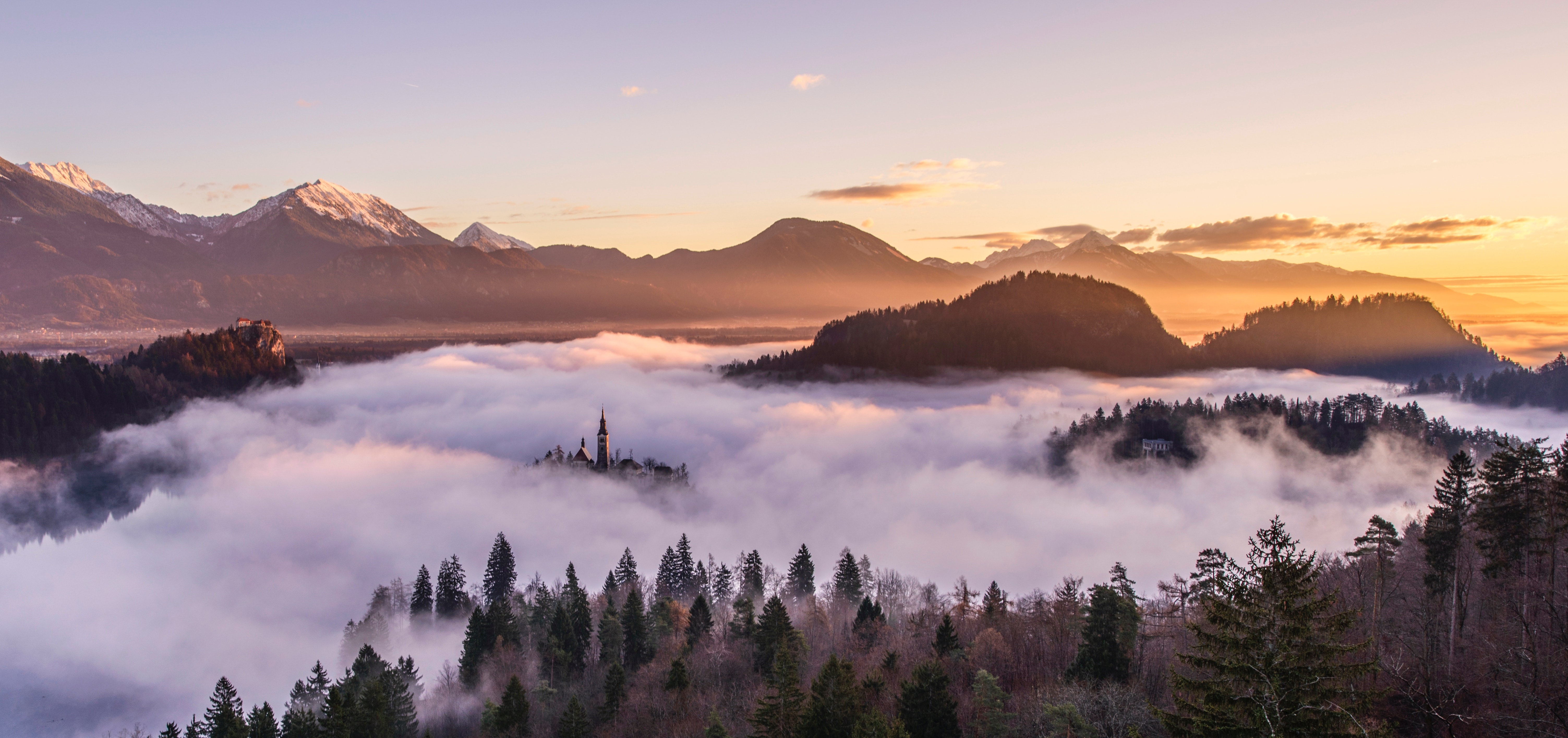 4K landscape of Lake Bled, Slovenia at sunrise with mist HD Wallpaper