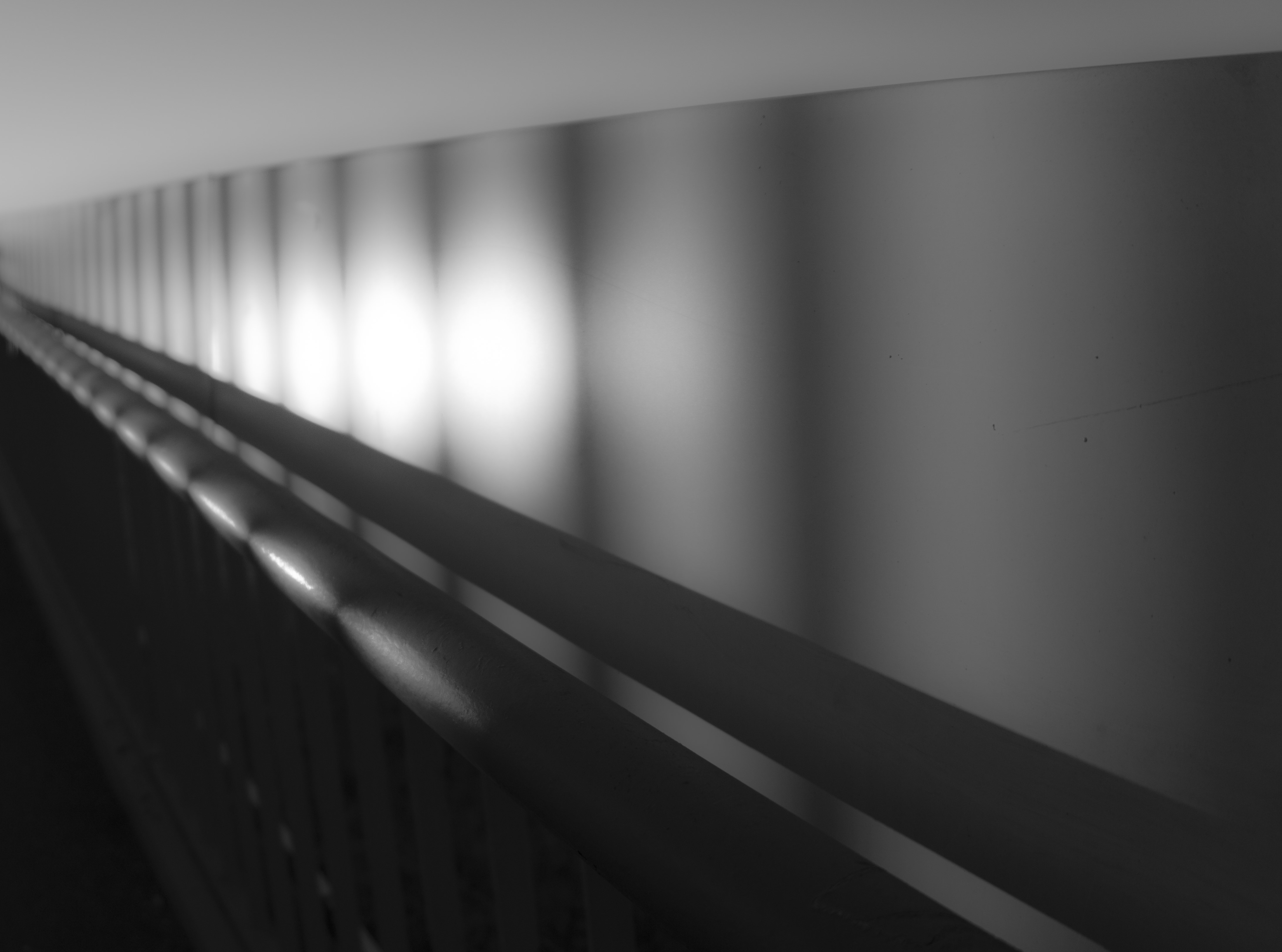 Monochrome abstract light patterns on wall and railing HD Wallpaper