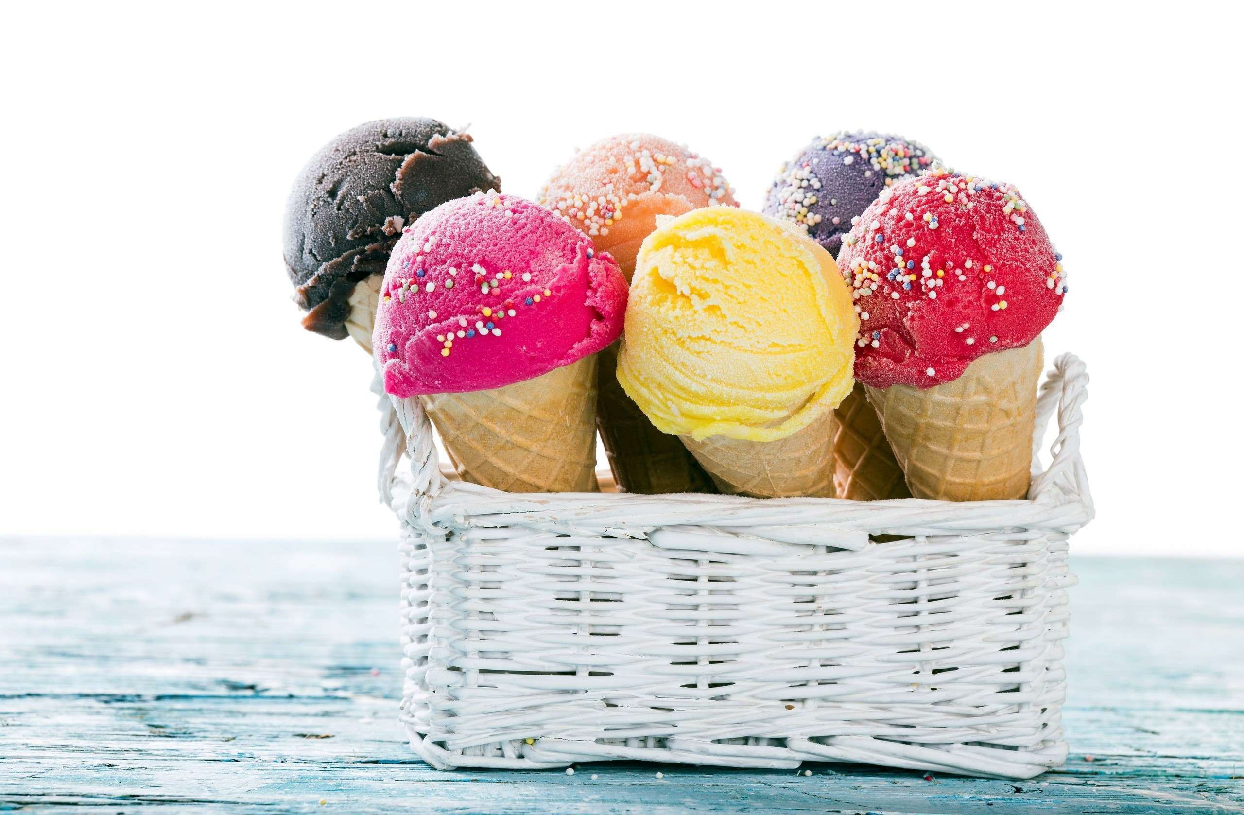 Assortment of ice cream cones in a white basket HD Wallpaper