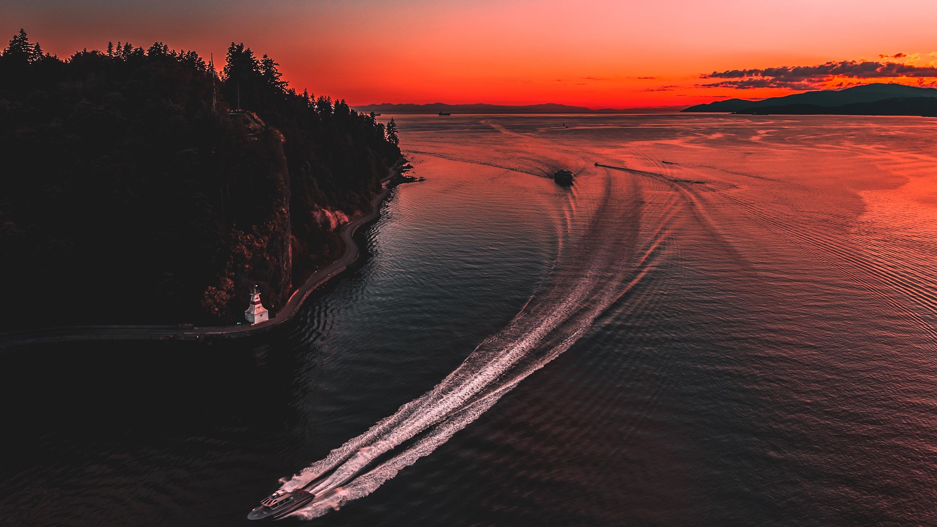 Aerial view of boats on the water at sunset in British Columbia HD Wallpaper
