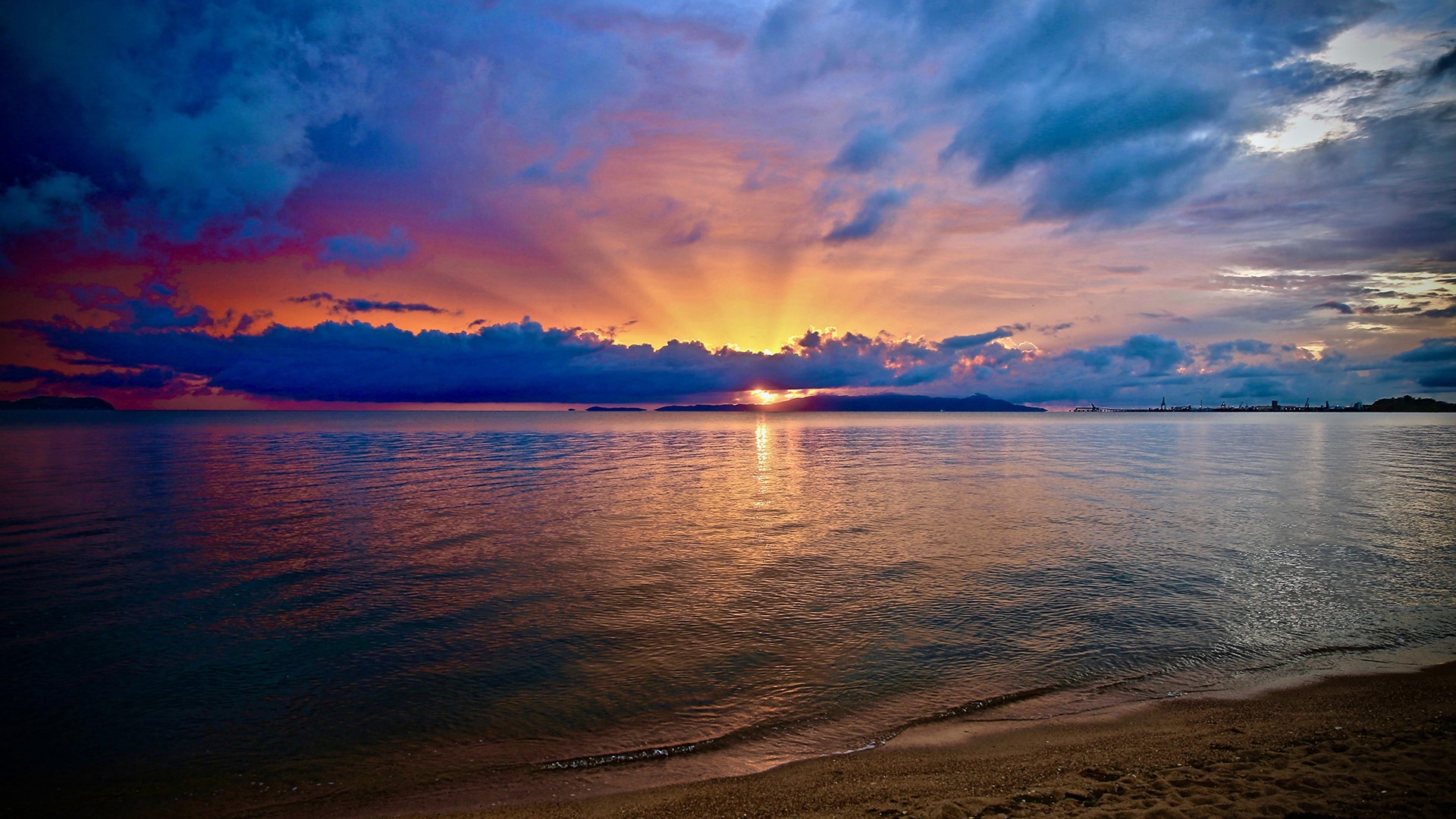 Sunset over the sea with colorful clouds and beach HD Wallpaper