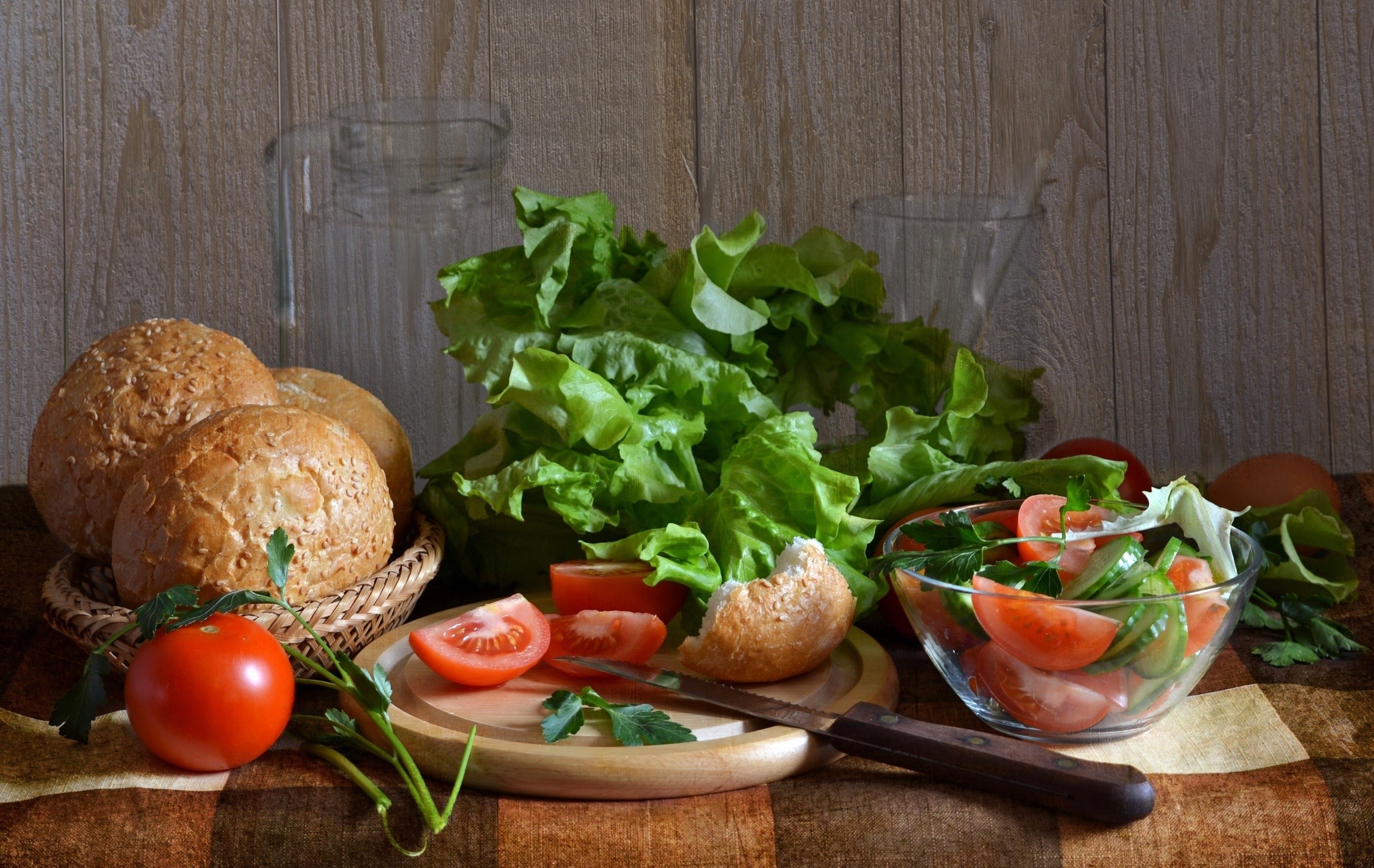 Salad ingredients with bread rolls and tomatoes HD Wallpaper