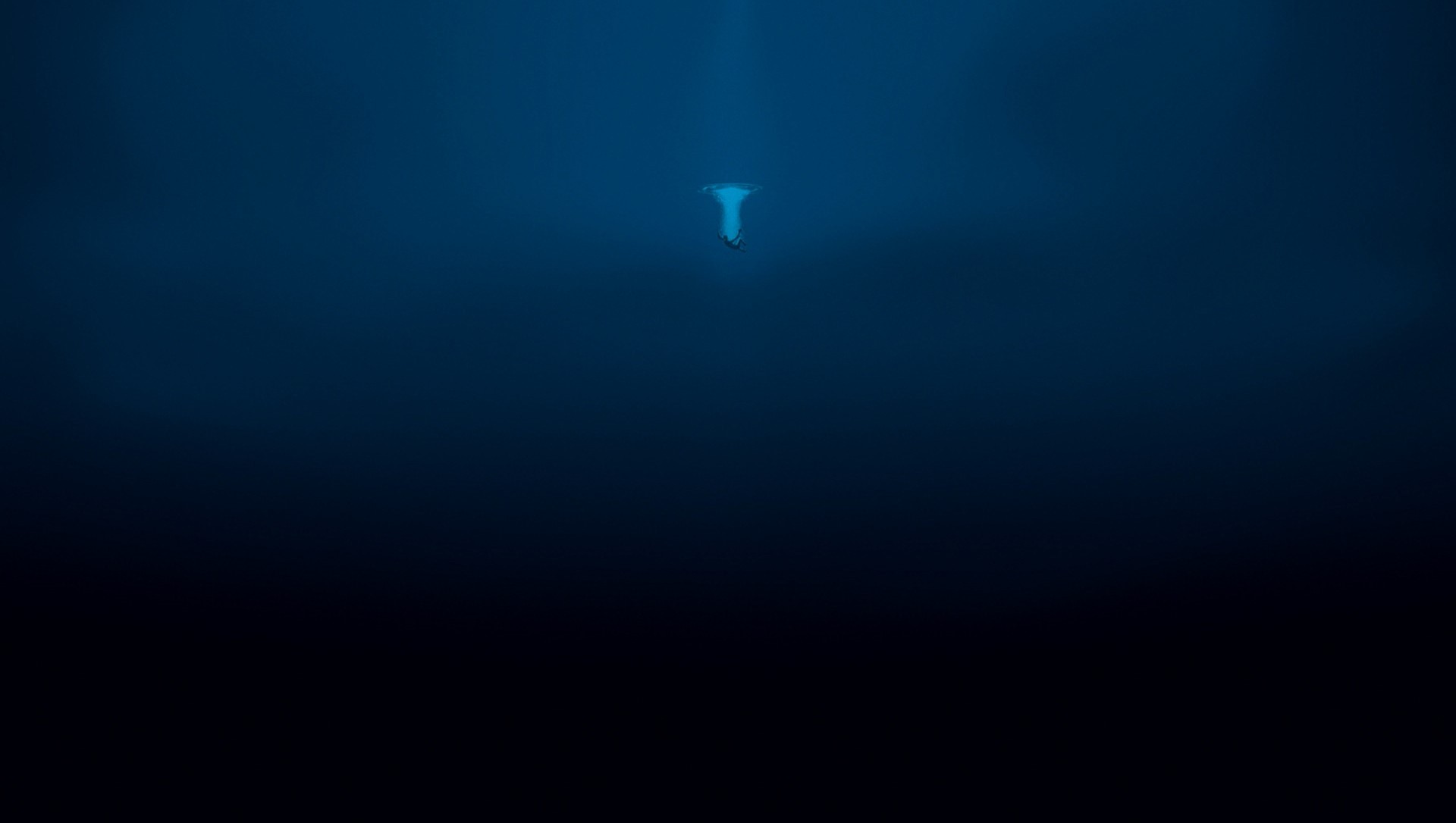 Person falling into deep blue water HD Wallpaper