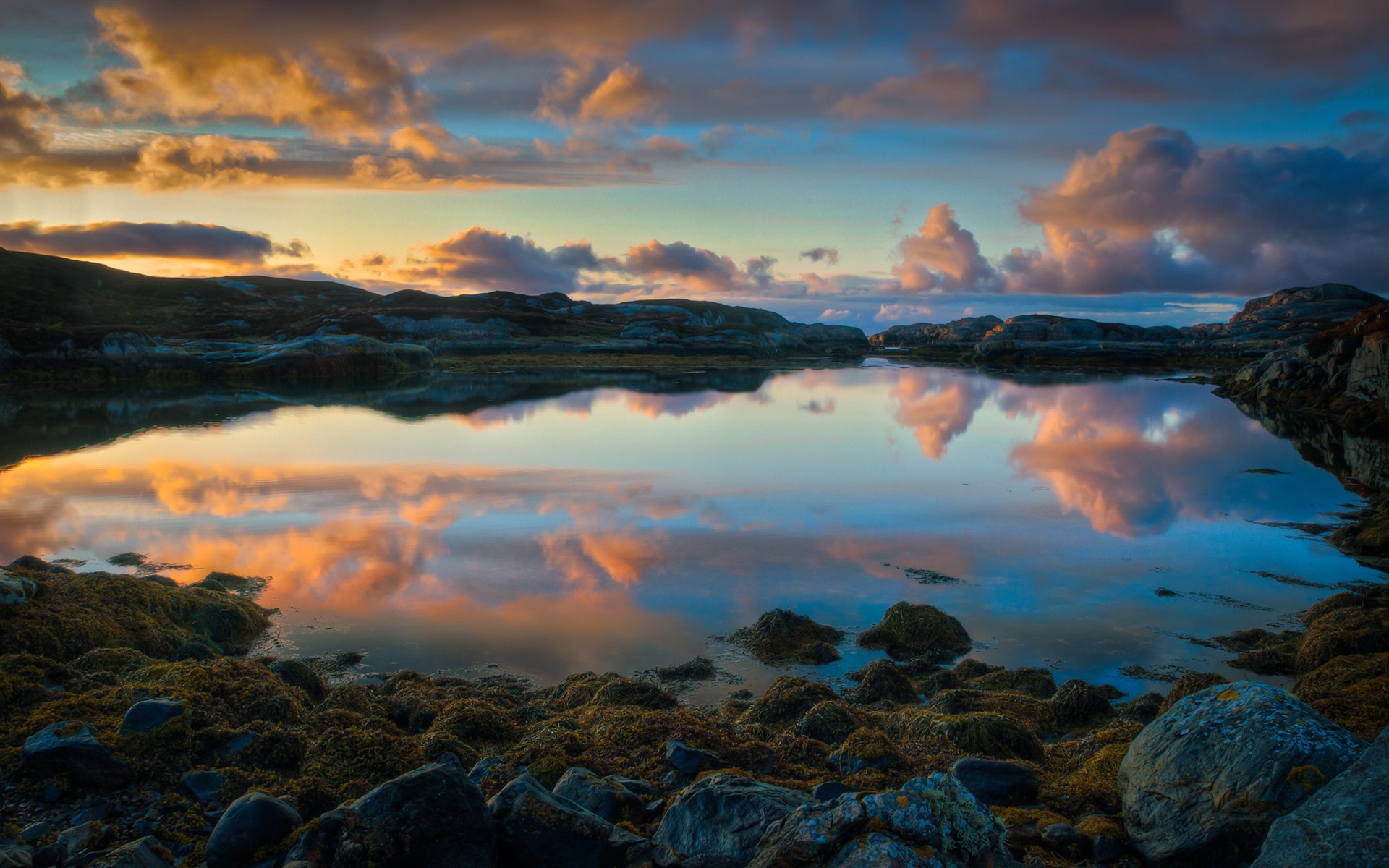Sunset reflection over a rocky lake landscape HD Wallpaper