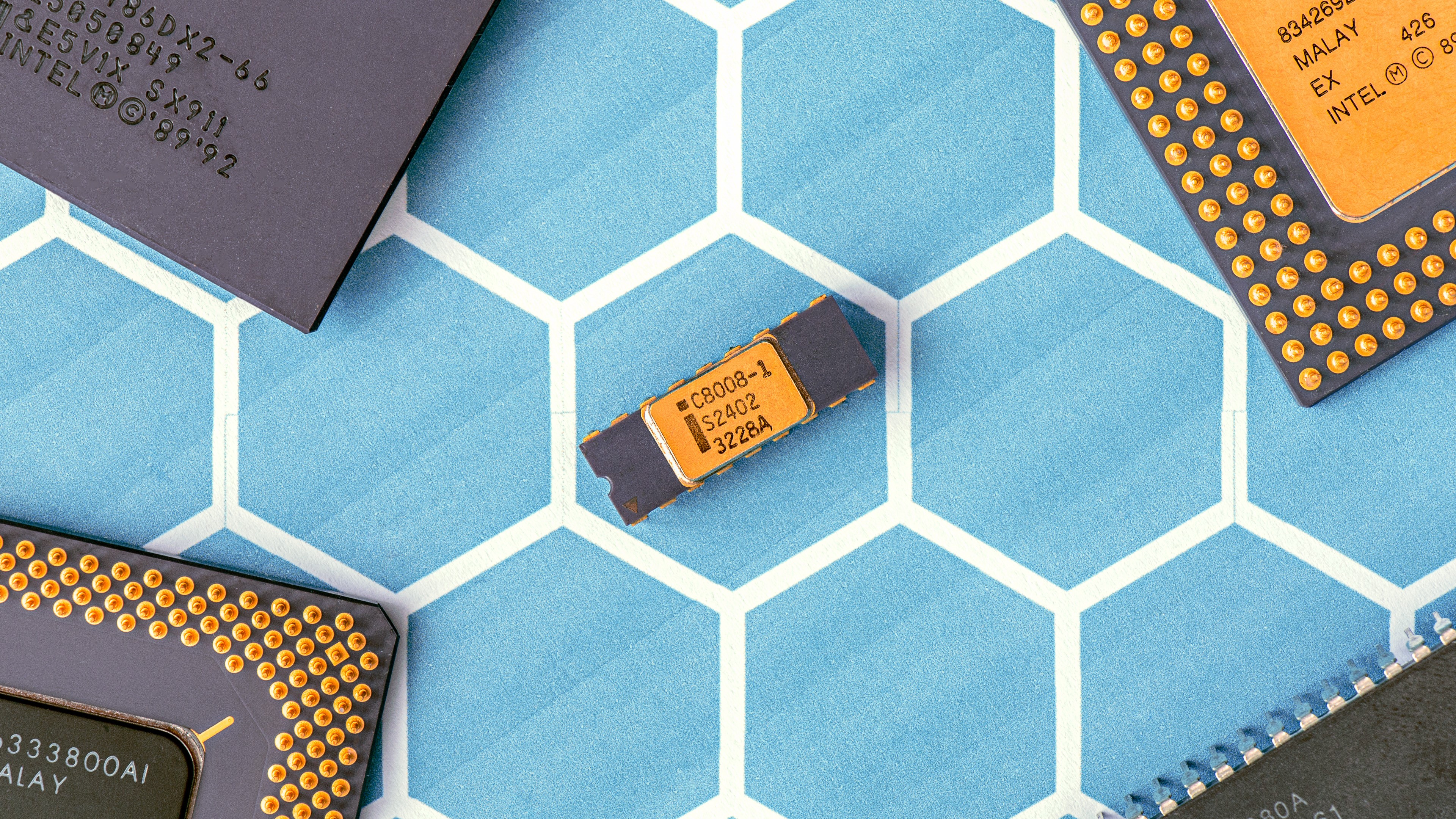 Intel CPUs on a blue hexagonal background HD Wallpaper