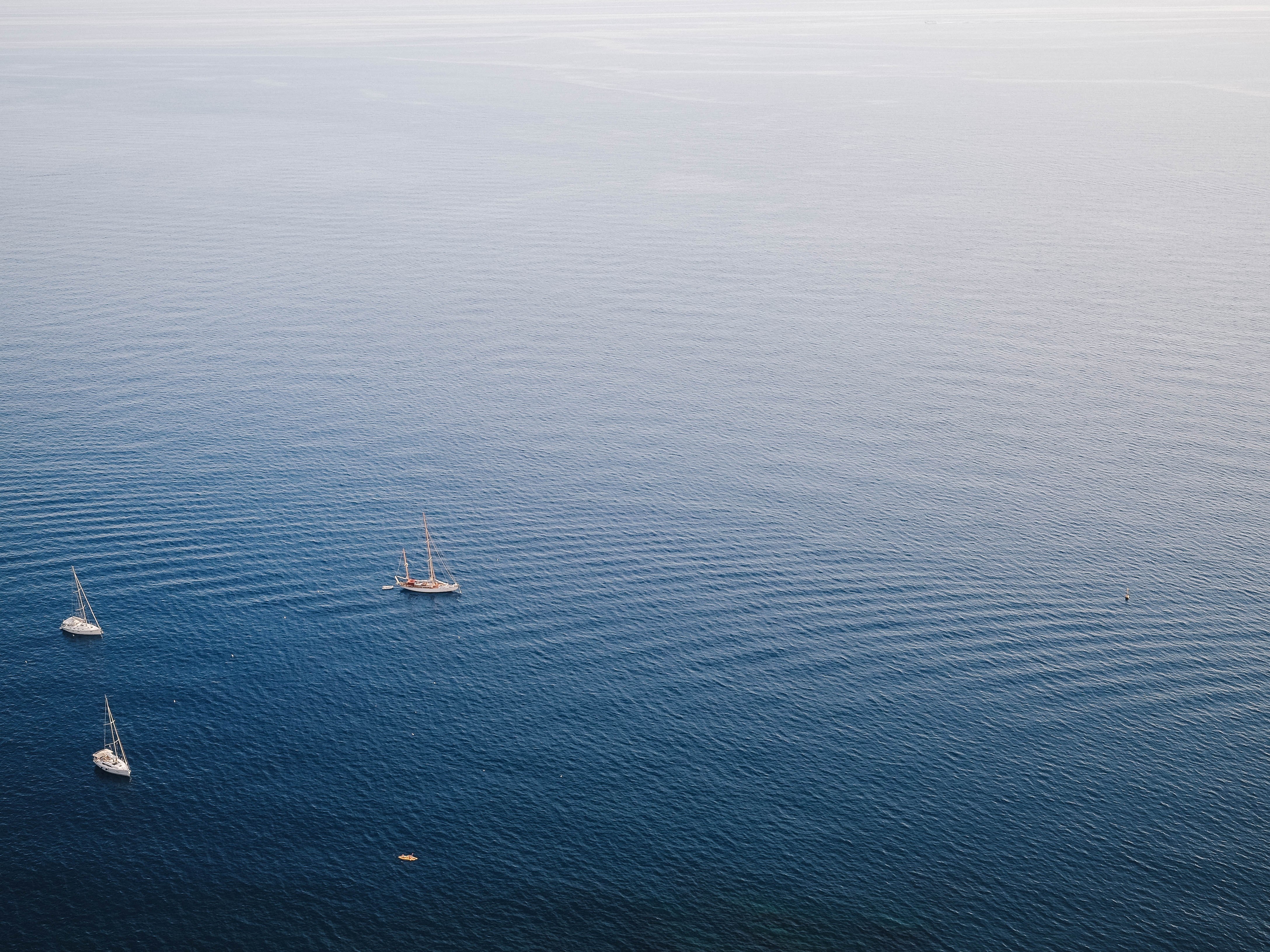 Sailboats on the sea with gentle waves HD Wallpaper
