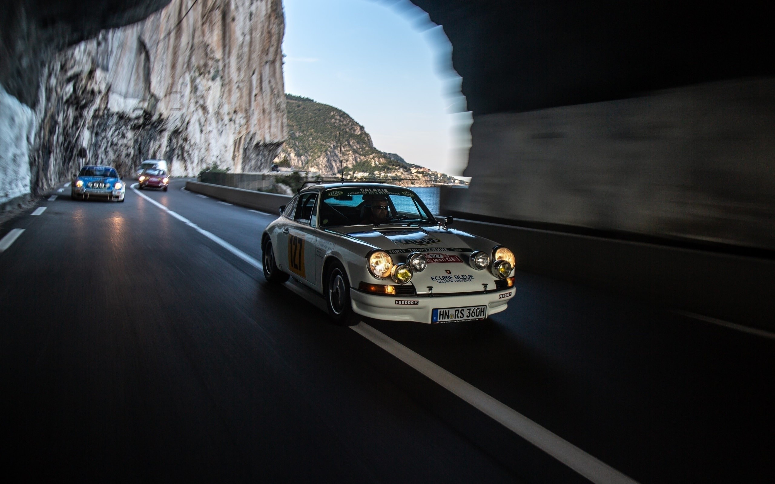 Porsche 911 rally car driving through a tunnel HD Wallpaper