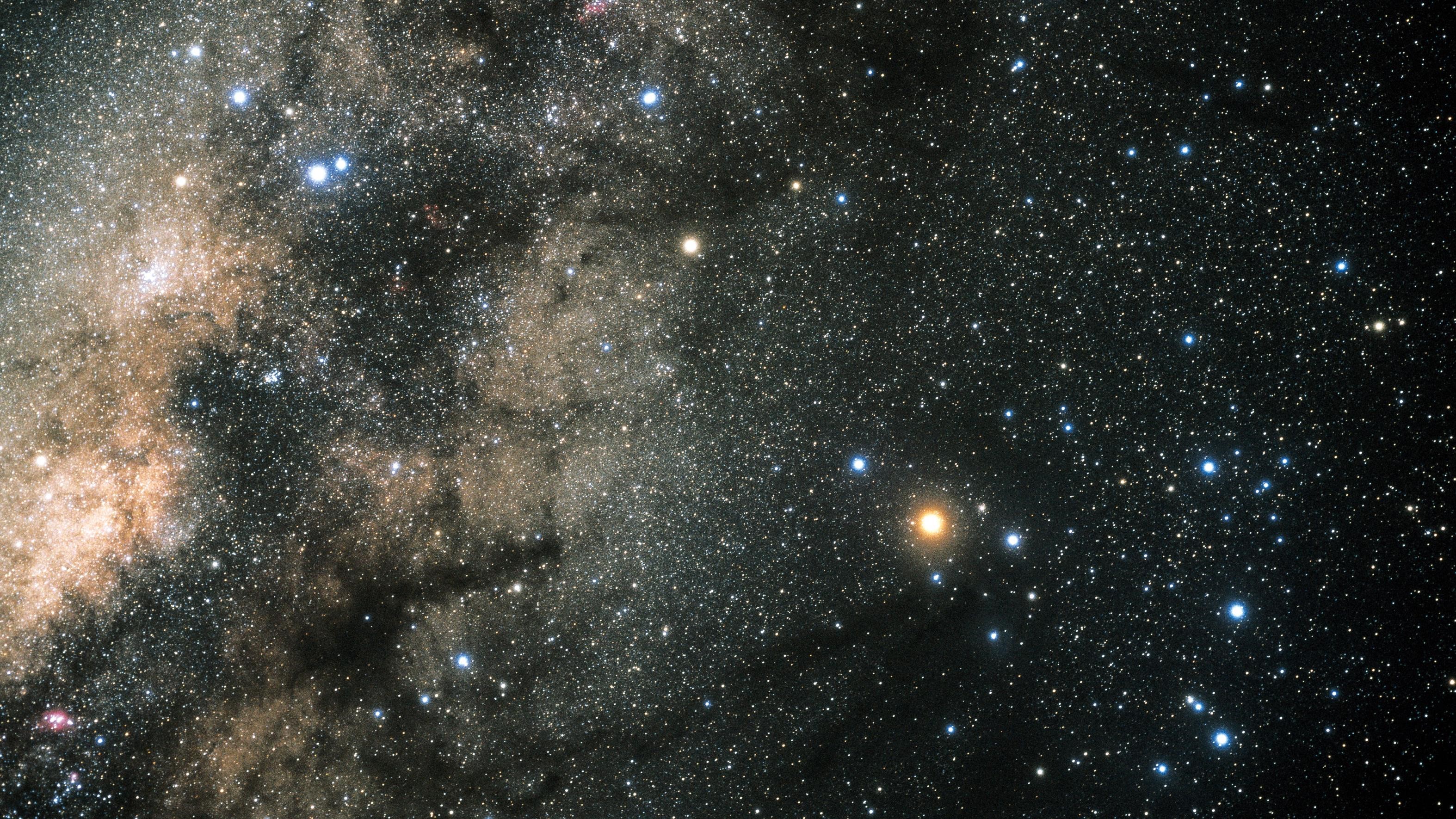 Starry night sky with nebulae and a bright star HD Wallpaper