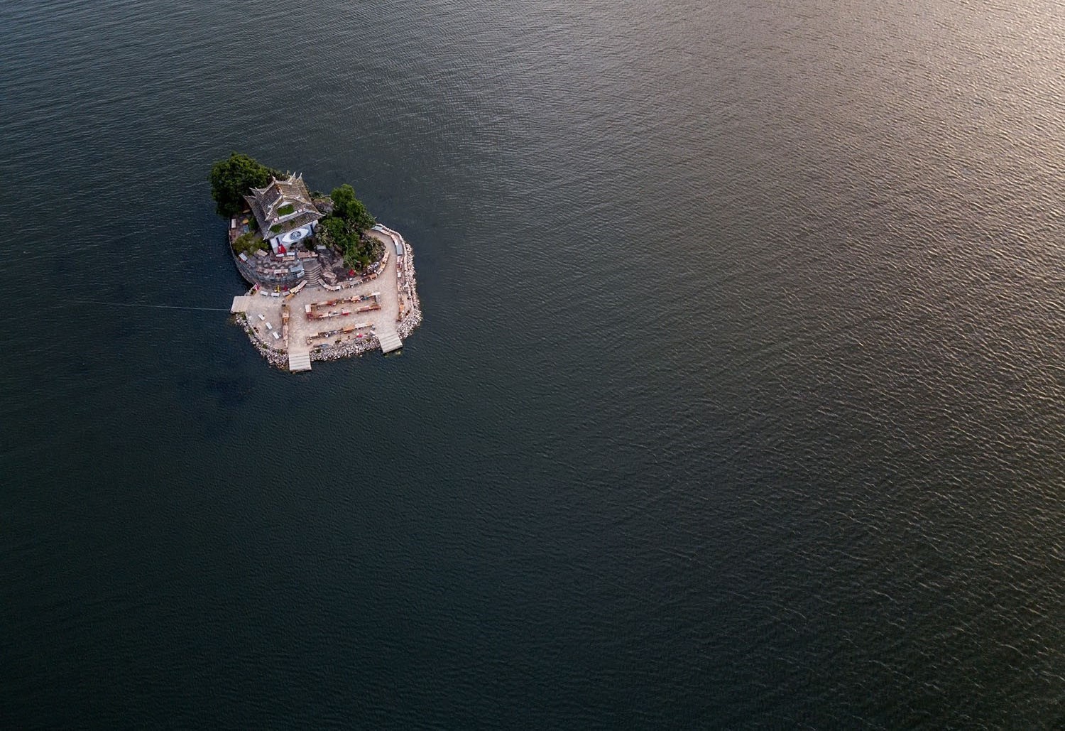 Aerial view of a small island with Asian architecture in a lake HD Wallpaper
