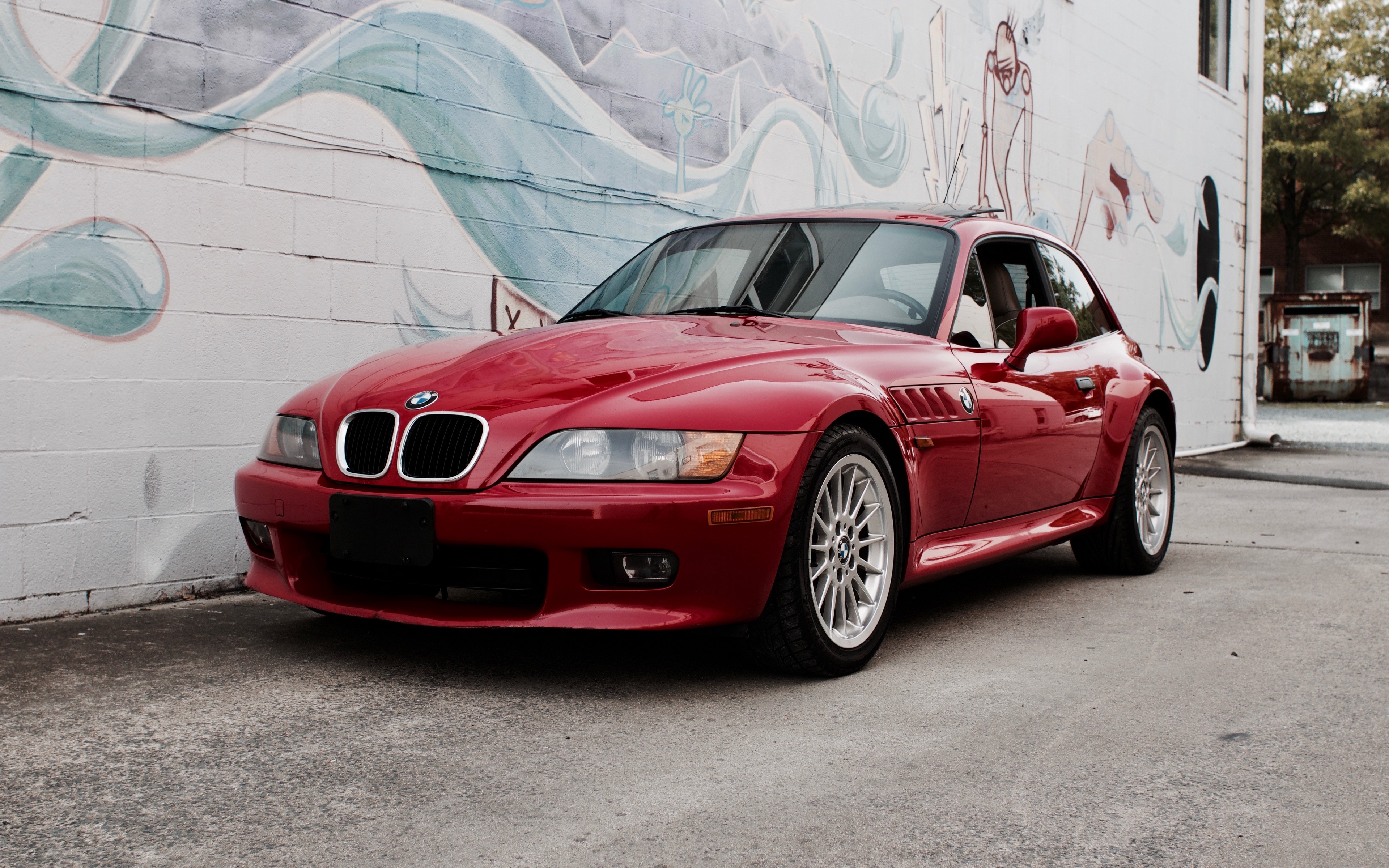 Red BMW Z3 Coupe parked by a mural HD Wallpaper