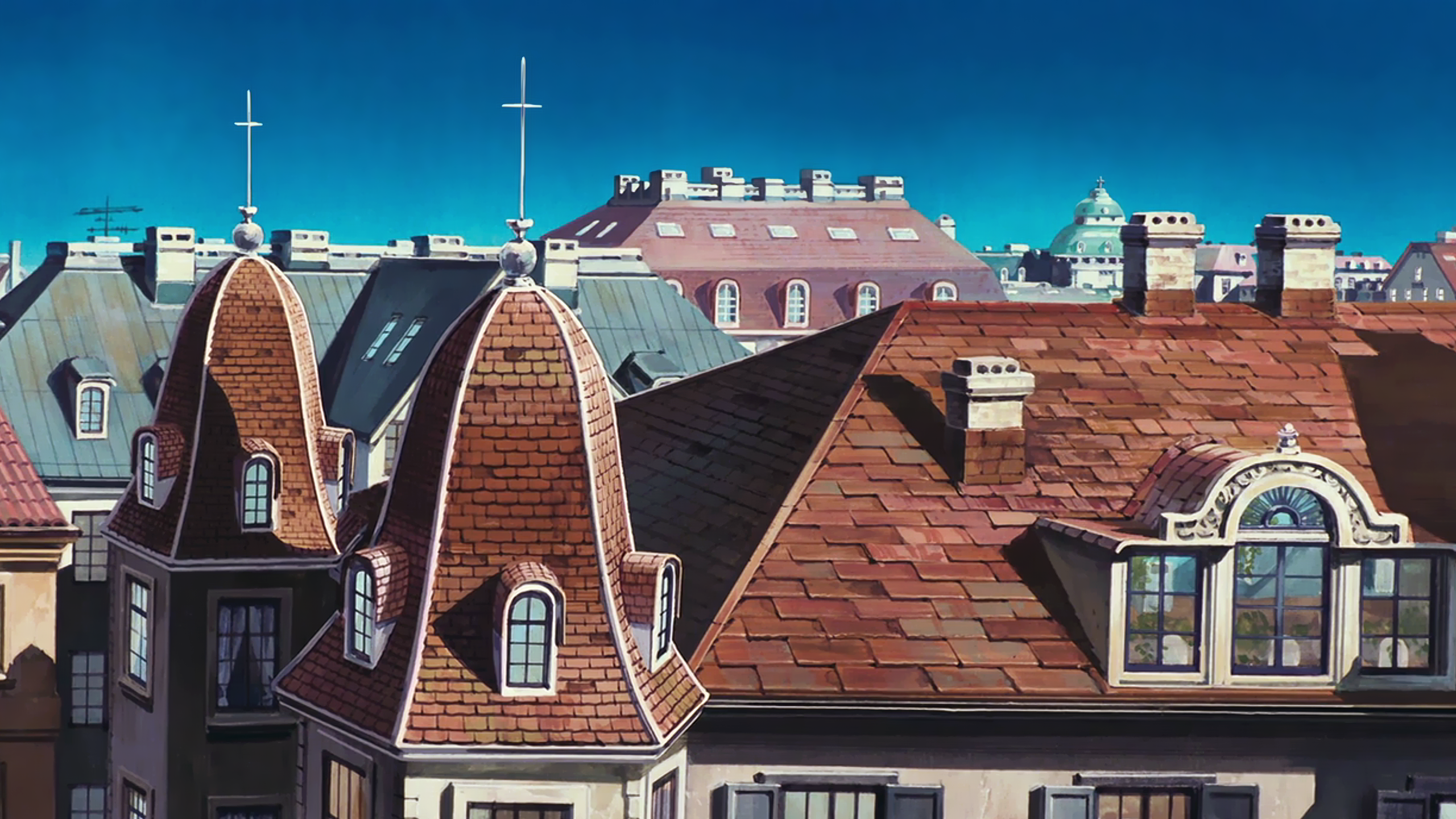 Rooftops of a European-style city under a blue sky HD Wallpaper