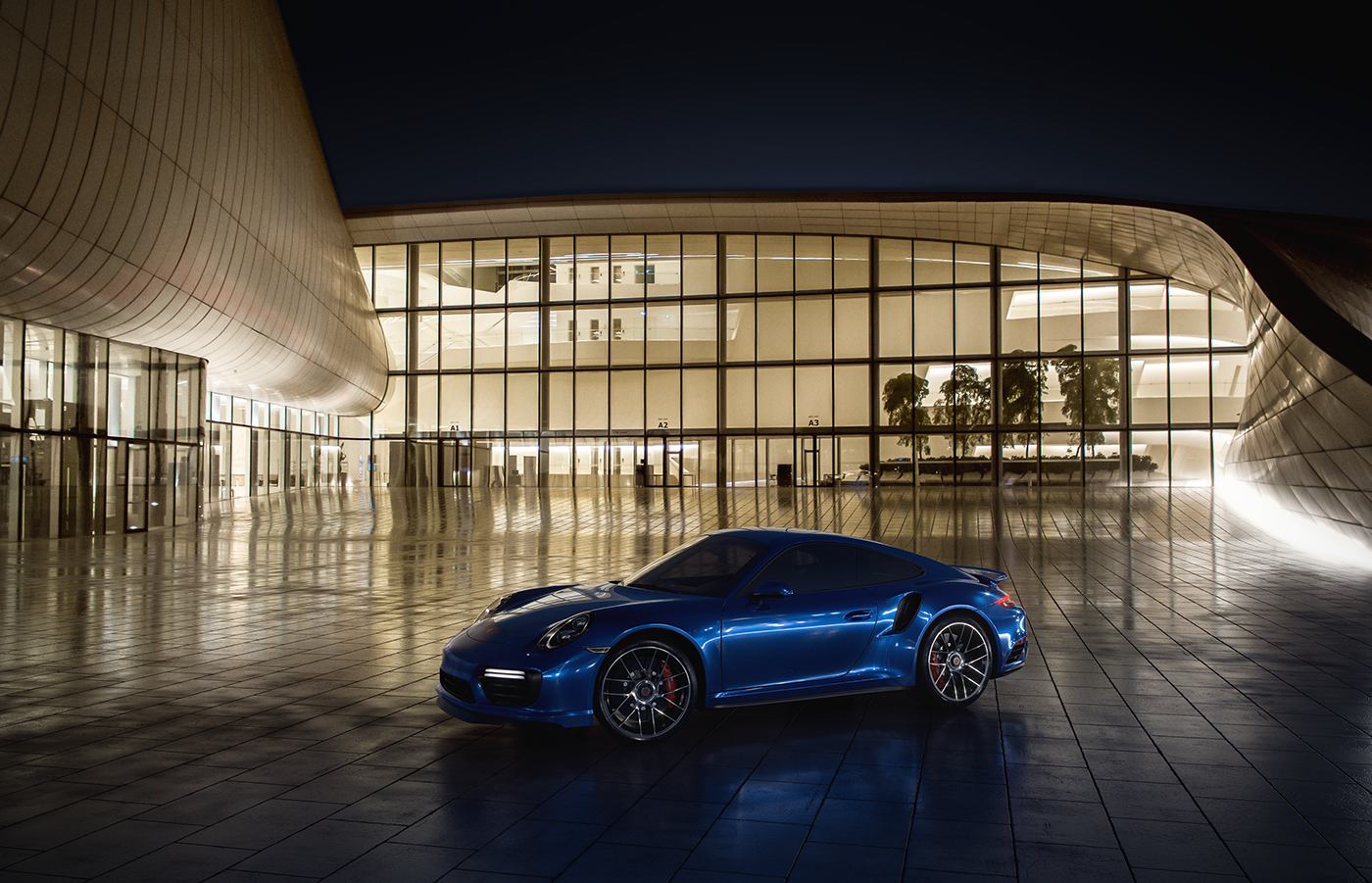 Blue Porsche 911 Turbo S parked at modern building at night HD Wallpaper
