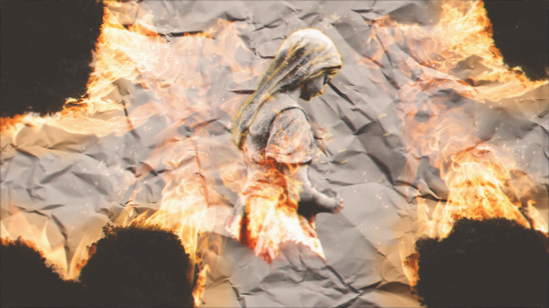 Statue on fire over crumpled paper HD Wallpaper
