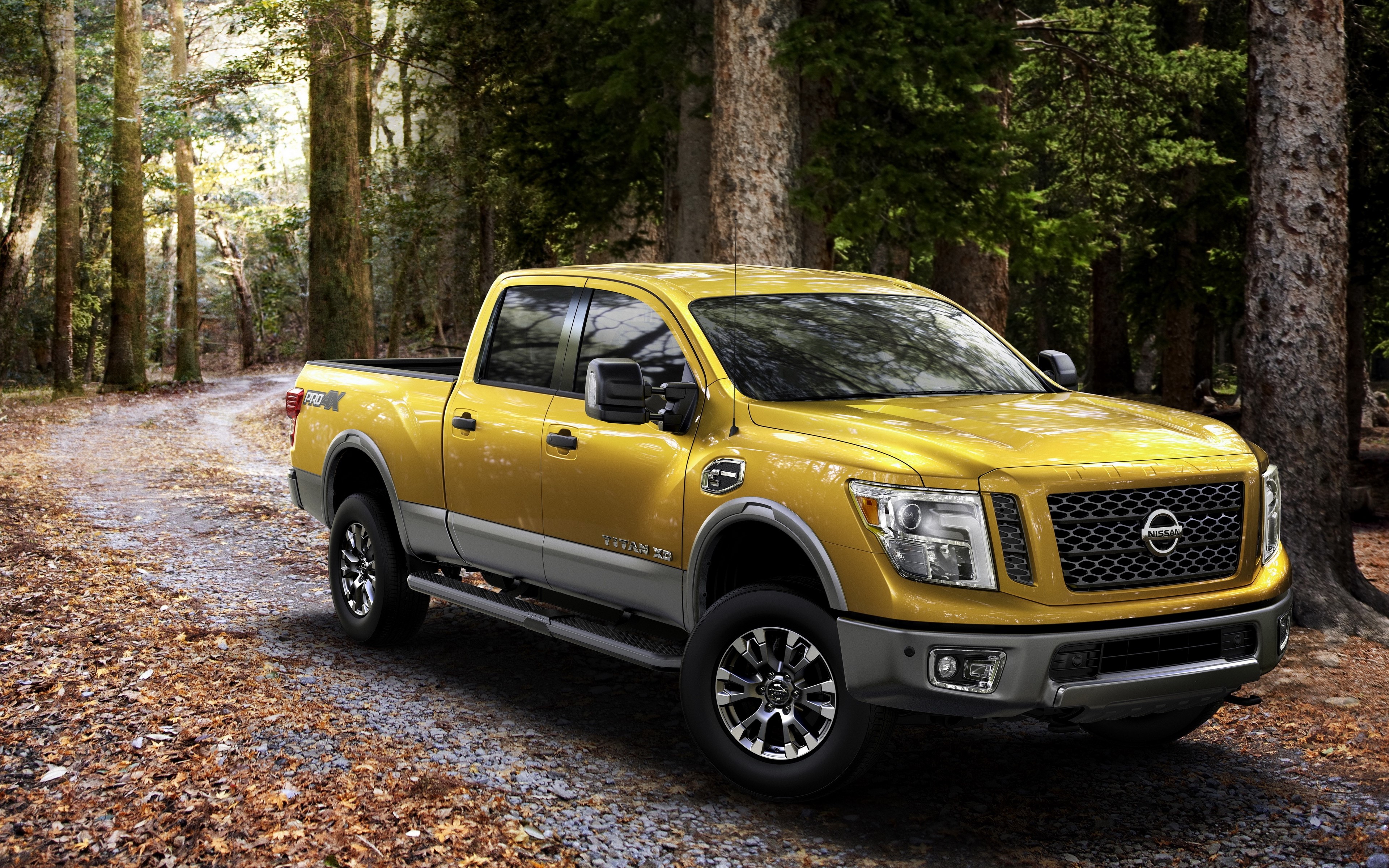 Yellow Nissan Titan XD pickup truck in forest HD Wallpaper