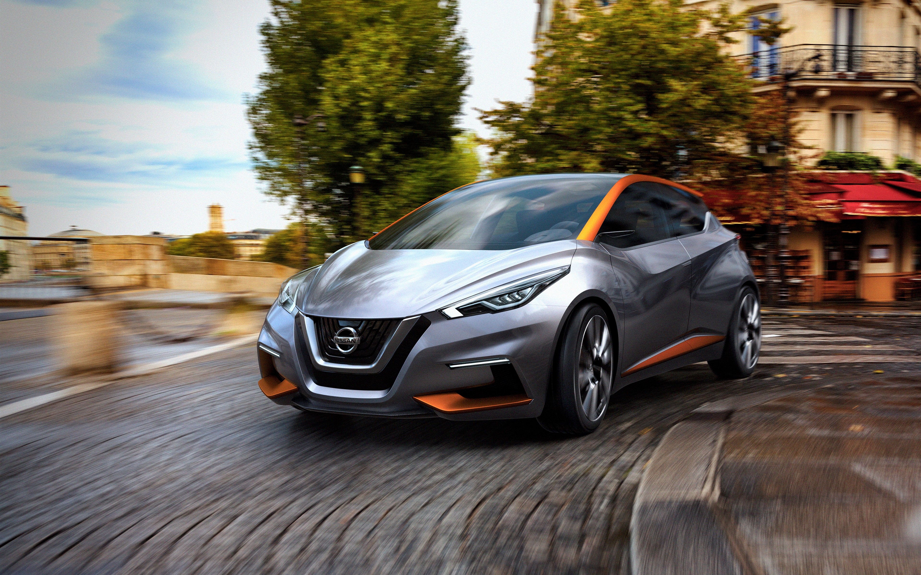 Nissan concept car driving on a street HD Wallpaper
