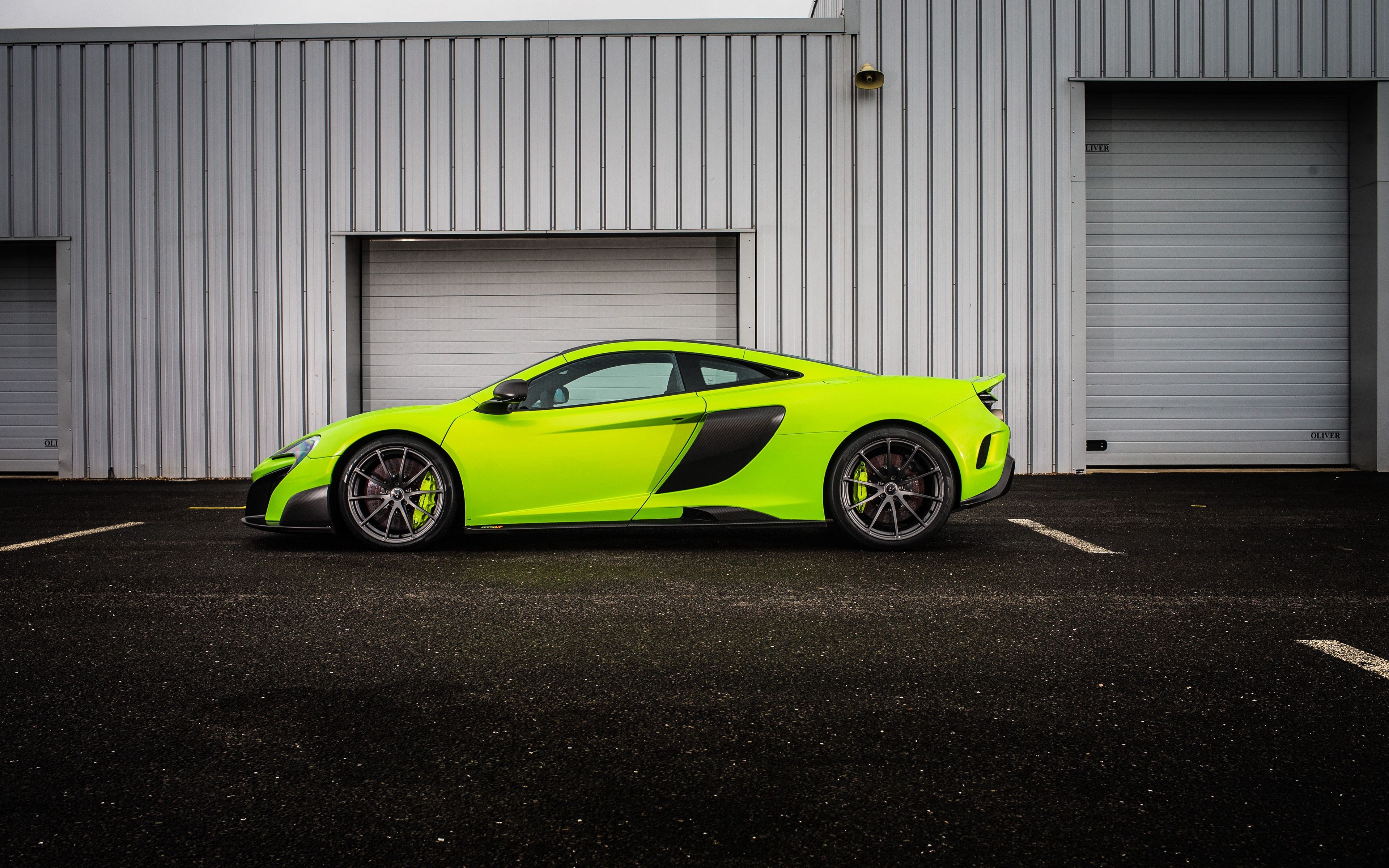 Lime Green McLaren 570S parked in front of a building HD Wallpaper