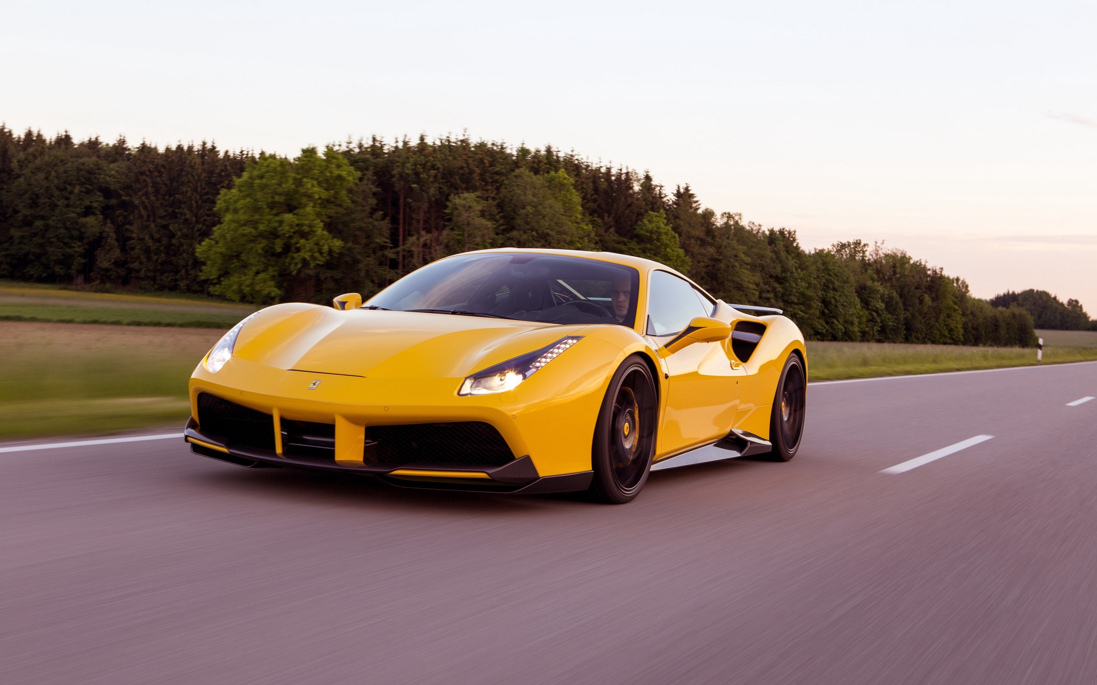Yellow Ferrari 488 Driving on a Road HD Wallpaper