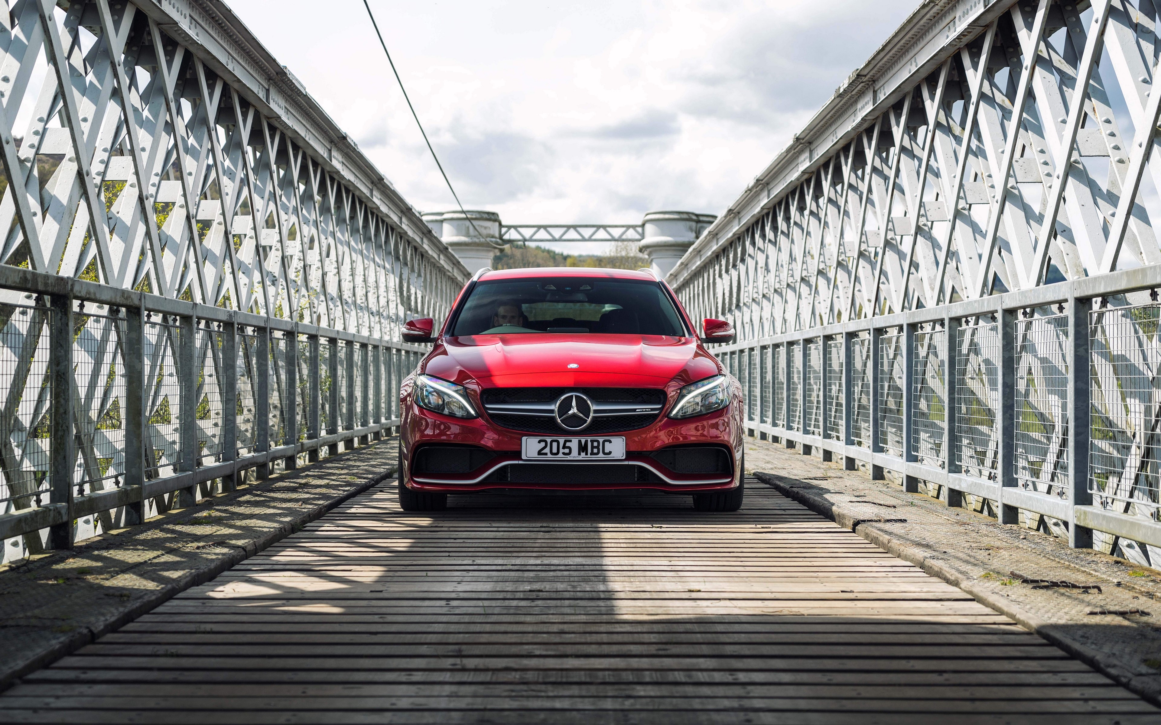 Red Mercedes Benz C63 AMG on a bridge HD Wallpaper