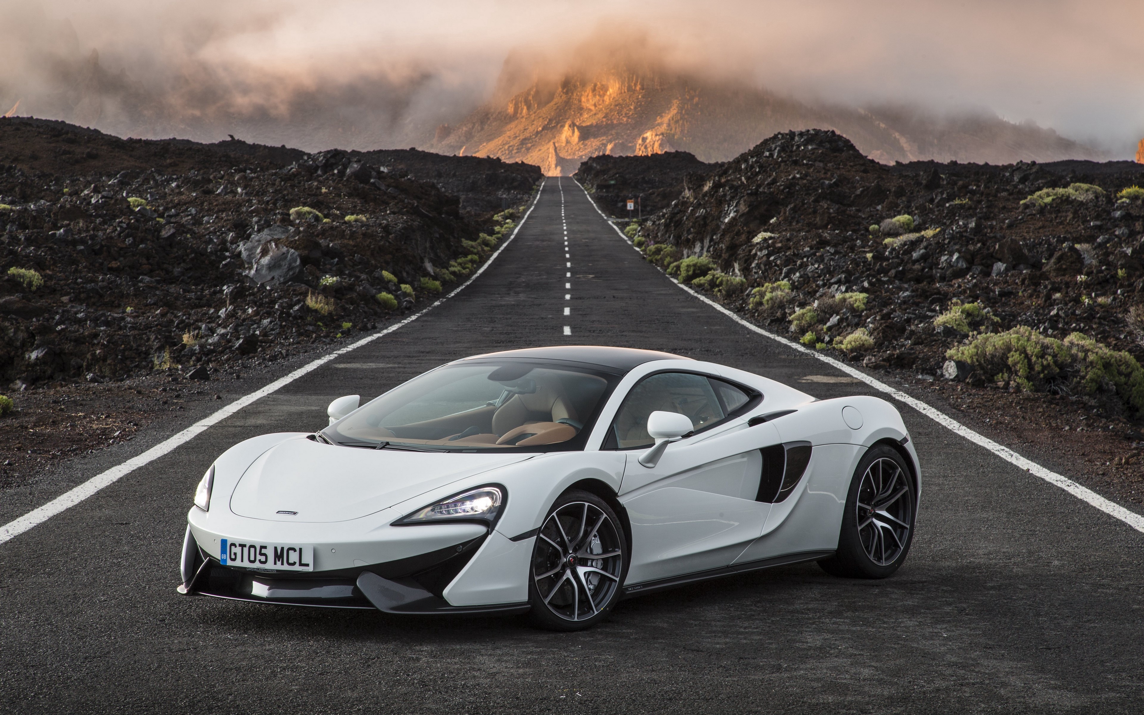 White McLaren 600LT on a mountain road HD Wallpaper