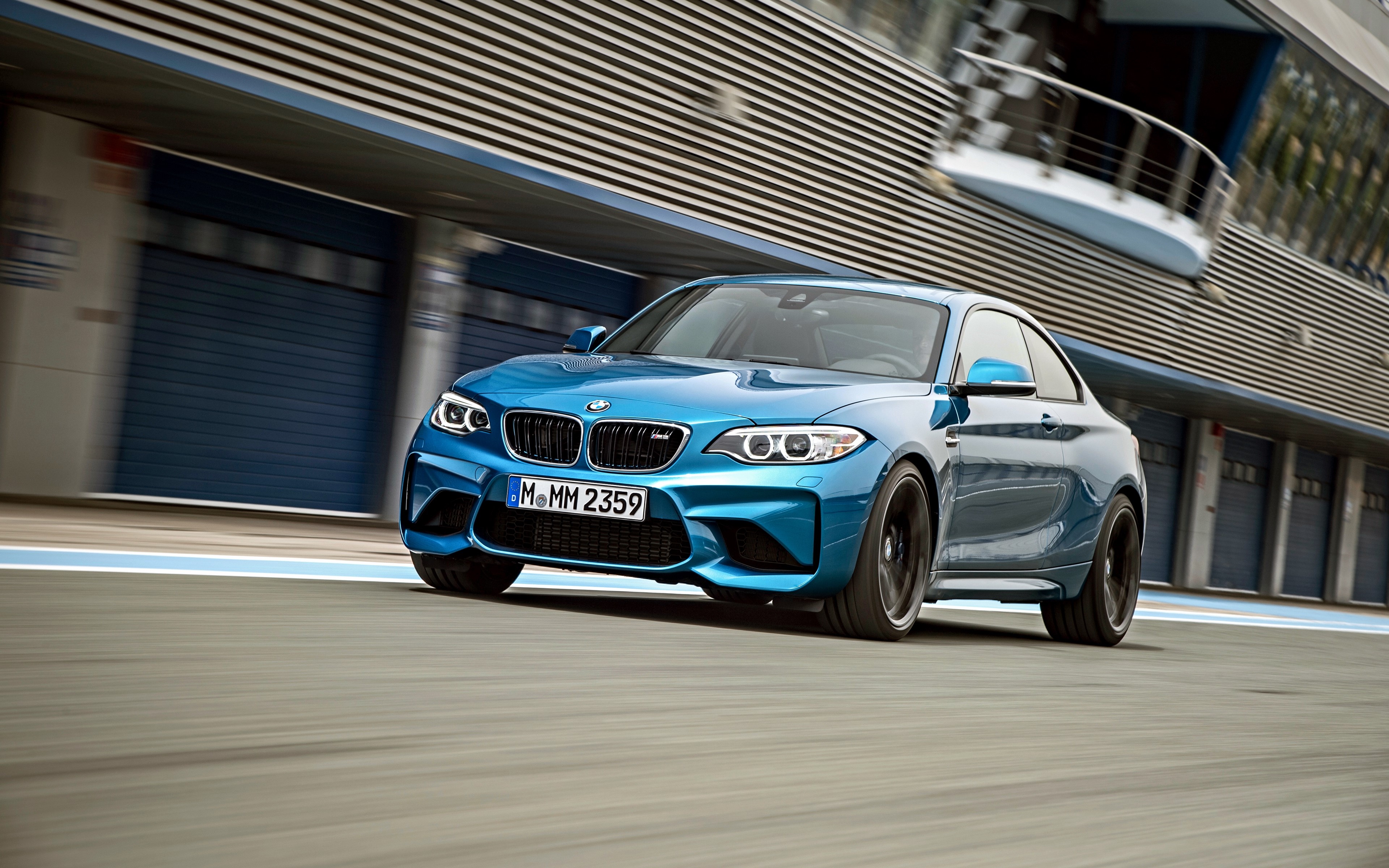 Blue BMW M2 on a Racetrack HD Wallpaper