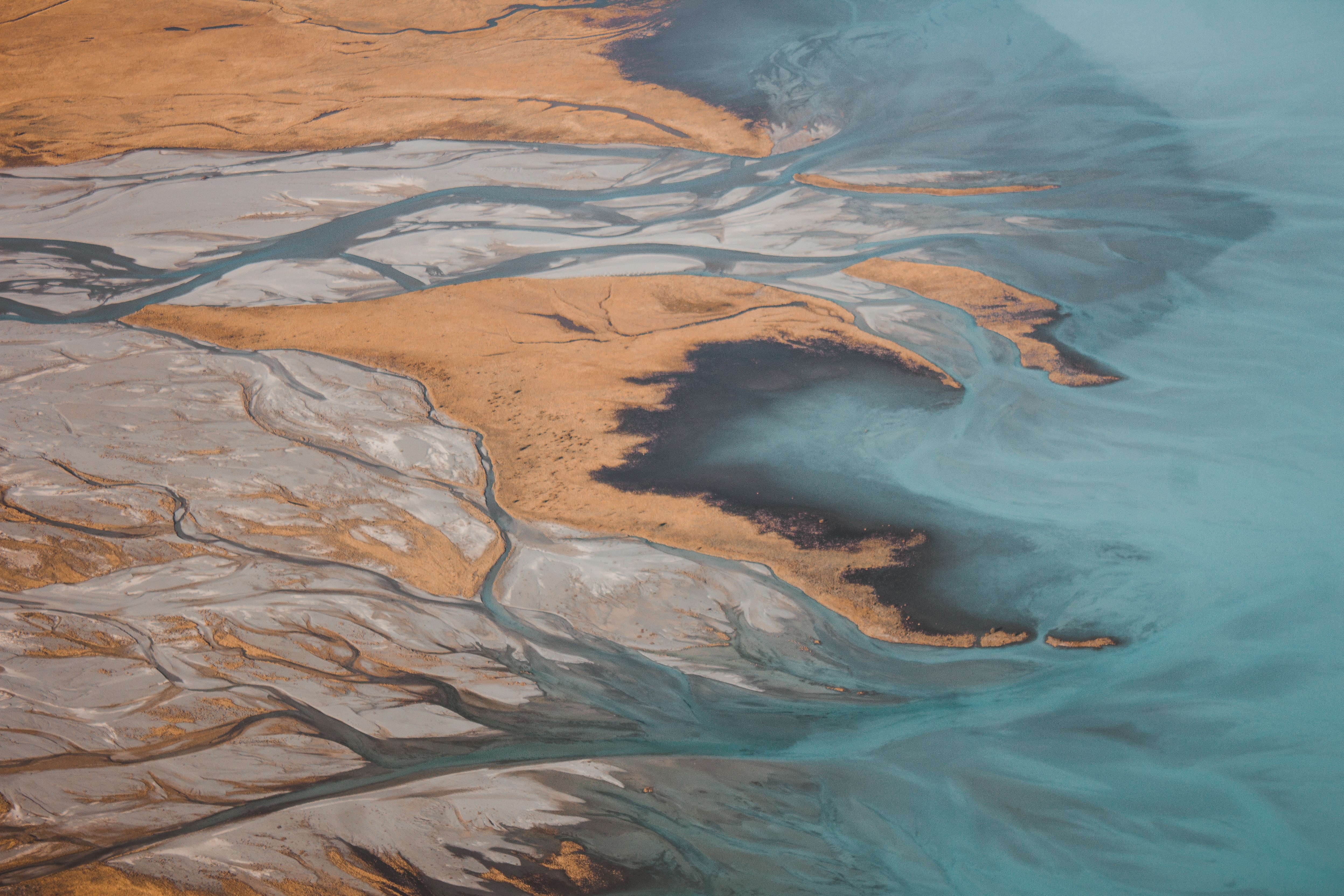 Aerial view of braided river delta with dry grass HD Wallpaper