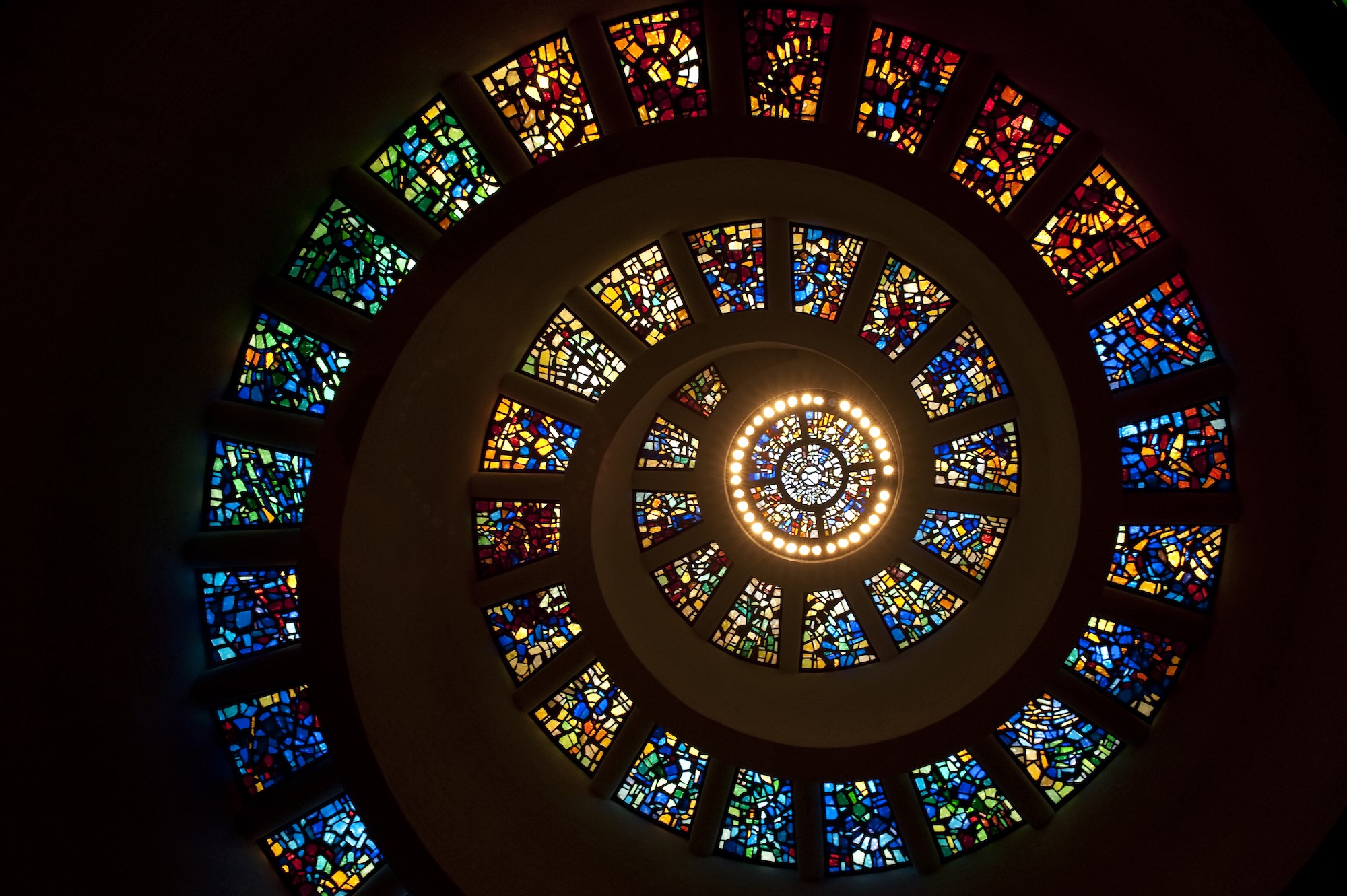 Spiral stained glass window with central light fixture HD Wallpaper