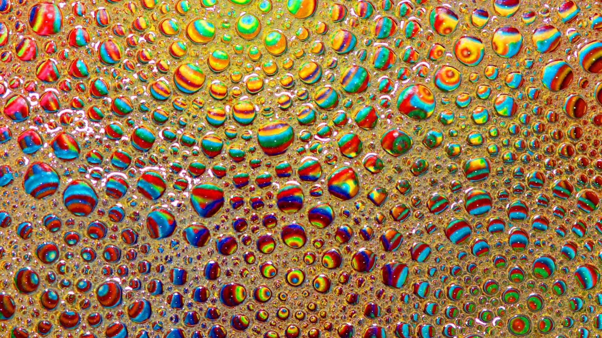 Colorful psychedelic bubbles on a golden surface HD Wallpaper
