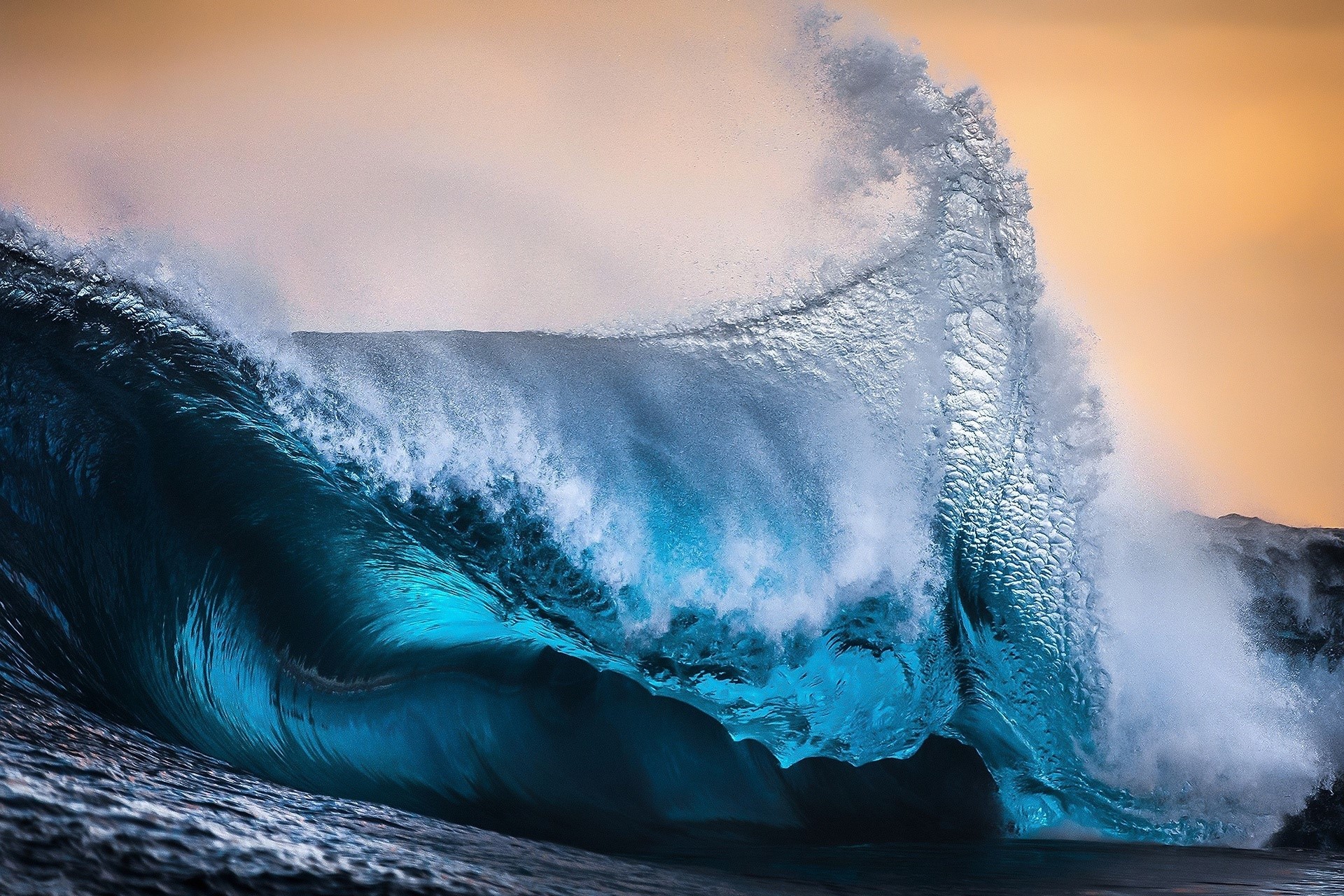Crashing ocean wave with golden sky HD Wallpaper