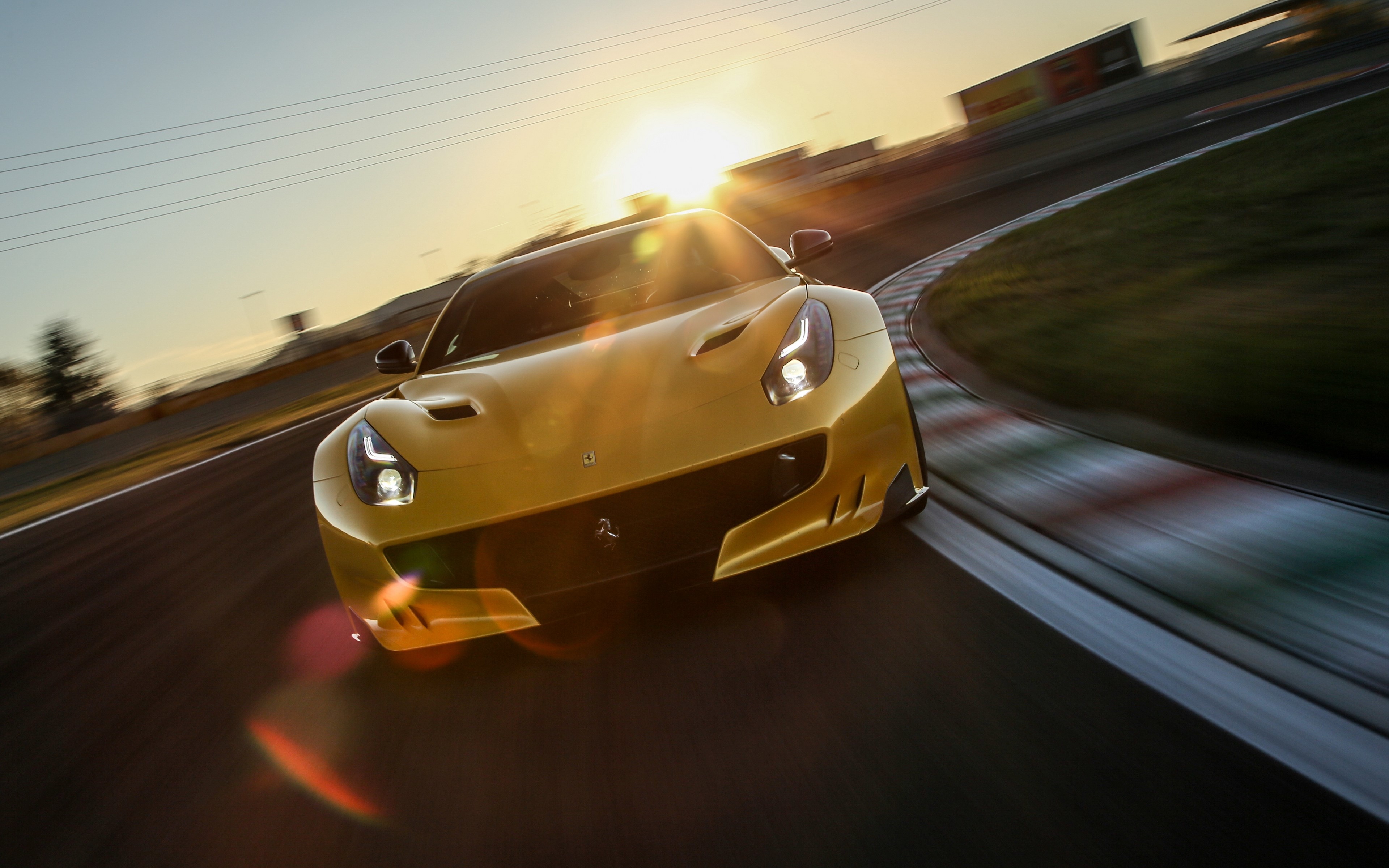 Yellow Ferrari F12 on a Racetrack HD Wallpaper
