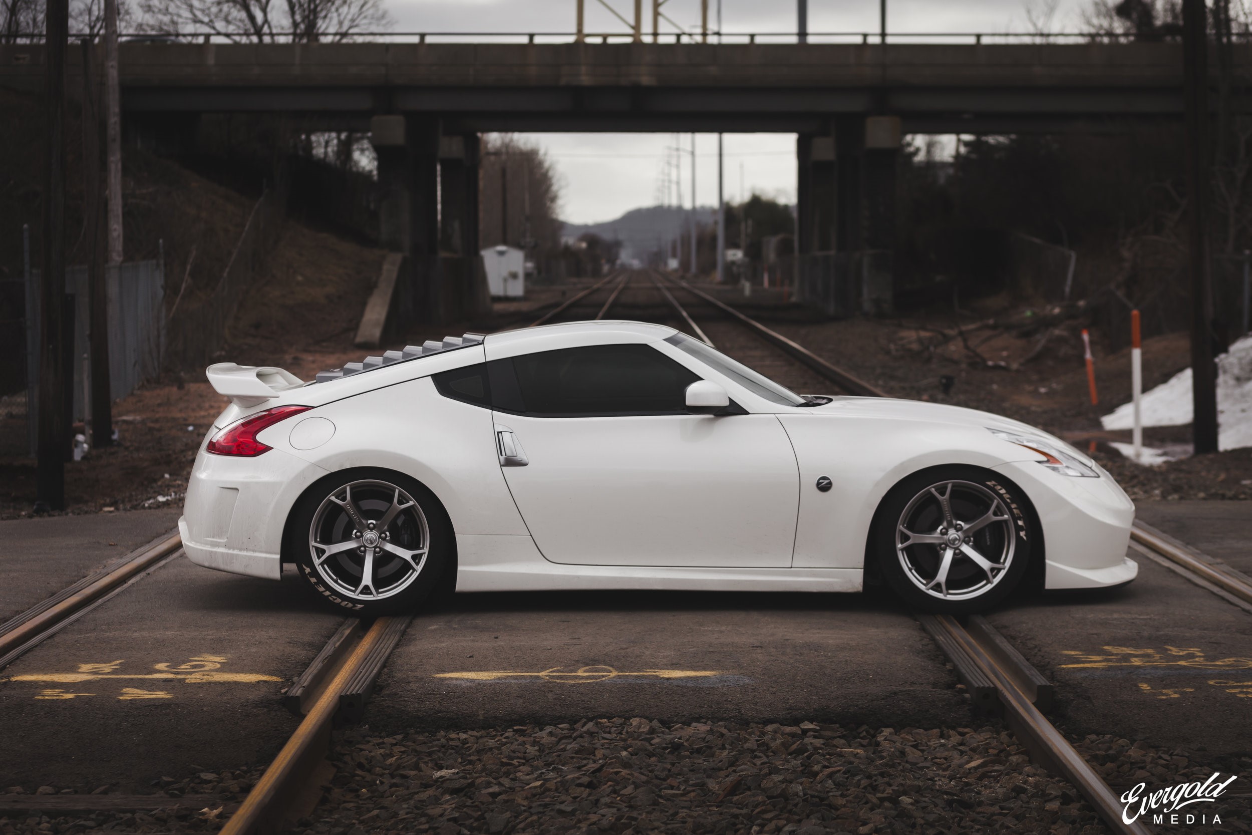 White Nissan 370Z on railway tracks HD Wallpaper