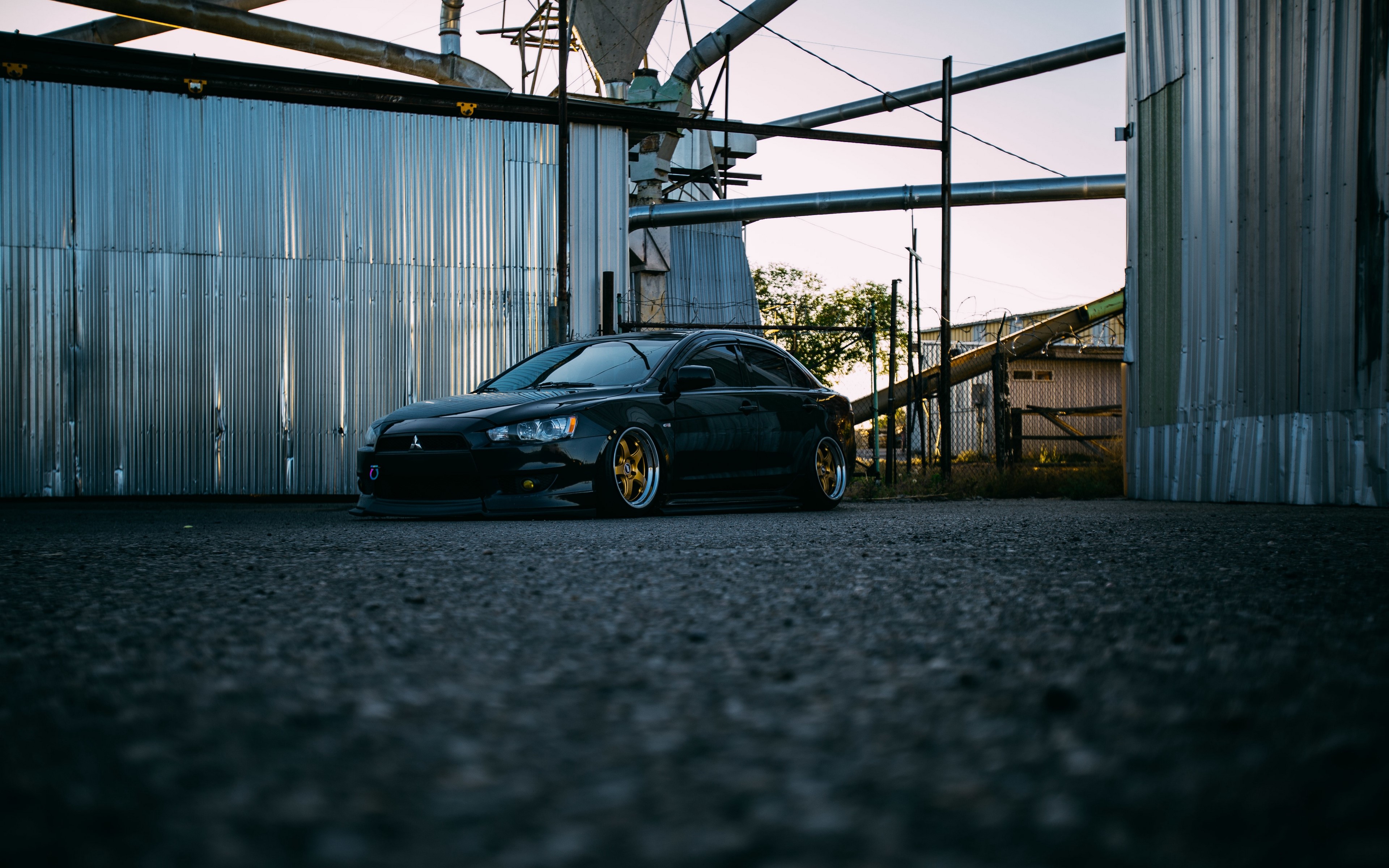 Black Mitsubishi Lancer with Gold Wheels HD Wallpaper