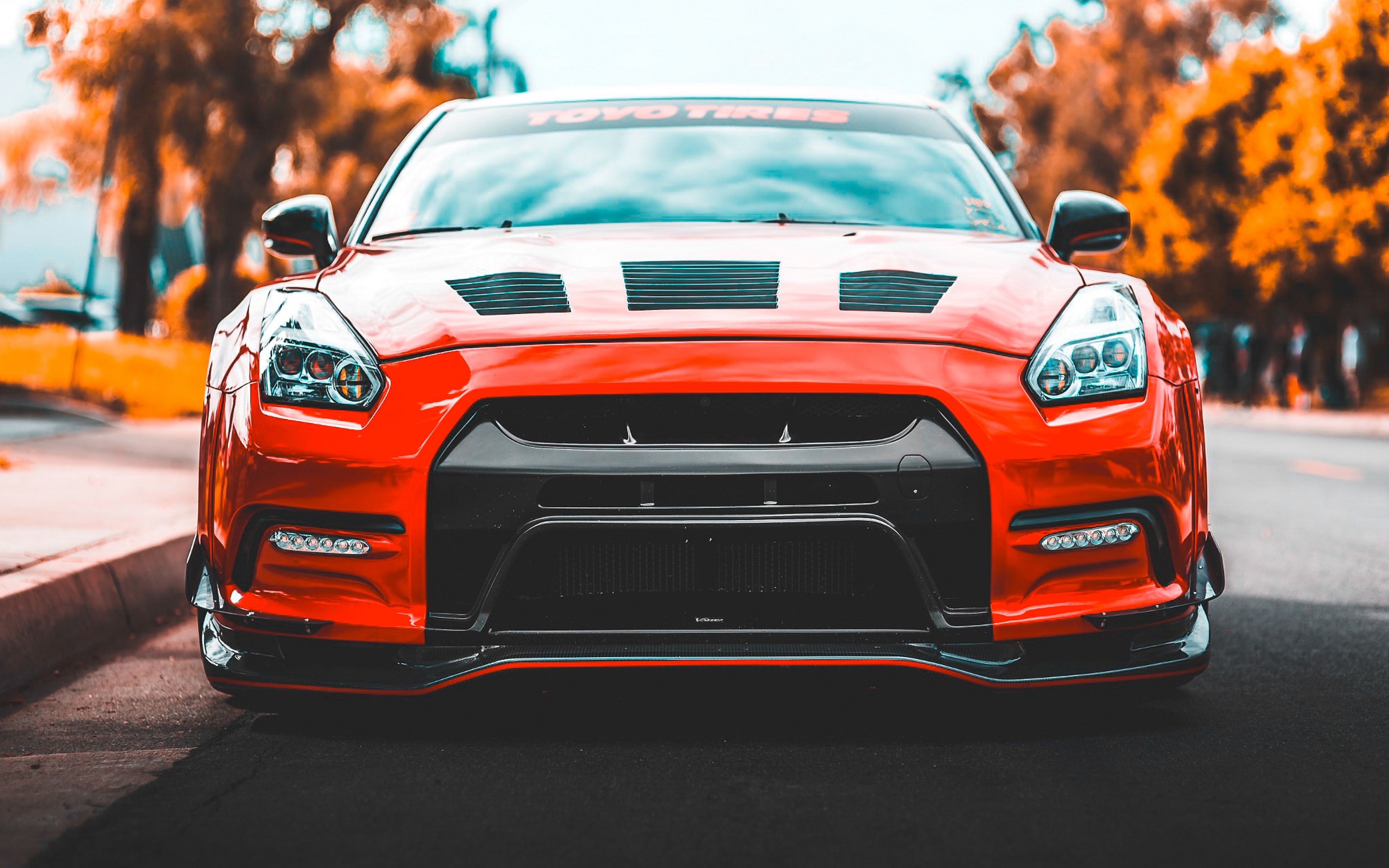Red Nissan GT-R with TOYO TIRES banner HD Wallpaper