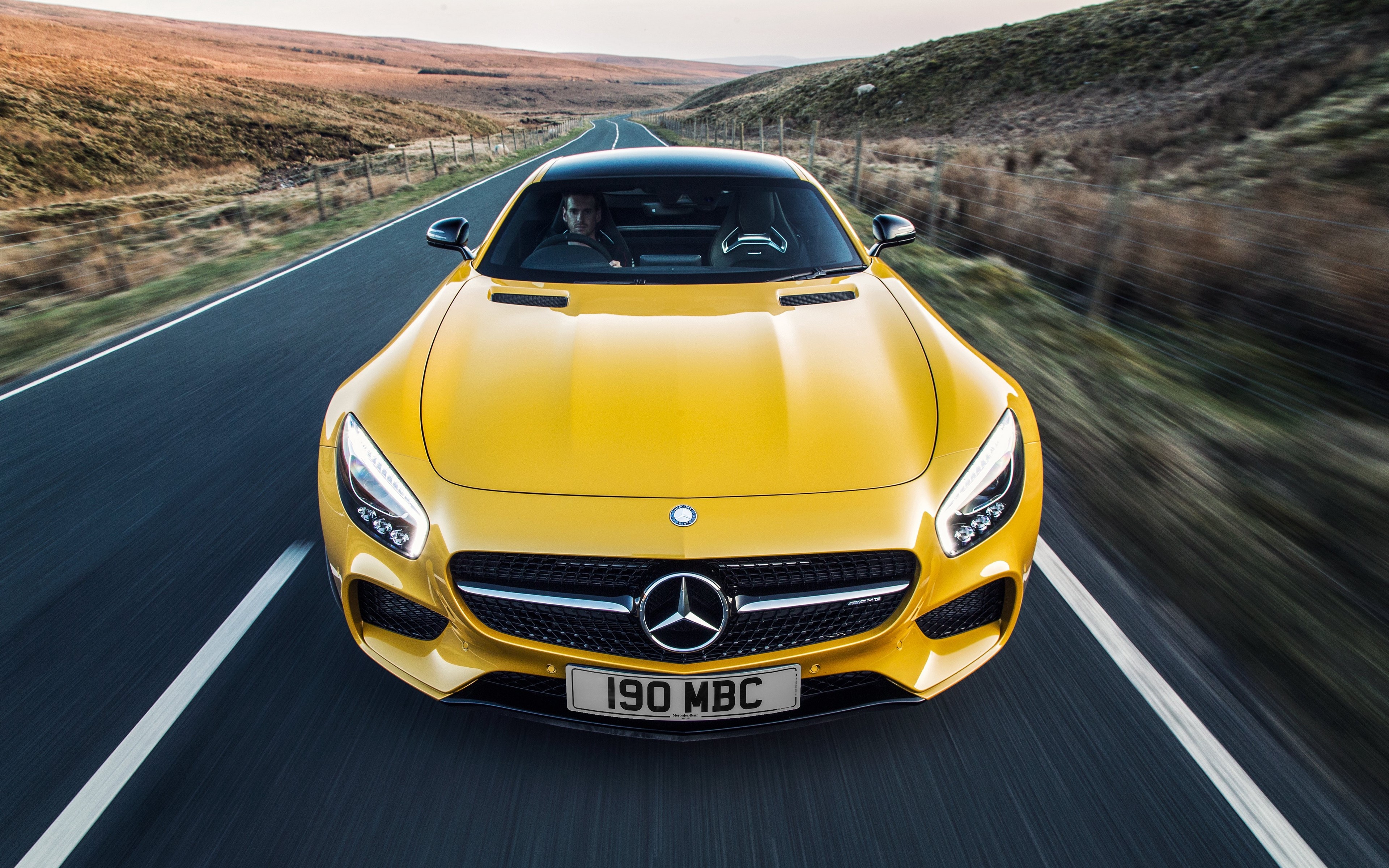 Yellow Mercedes-AMG GT Driving on a Road HD Wallpaper