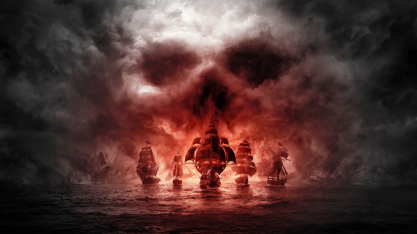 Pirate ships in front of a skull-shaped cloud formation HD Wallpaper