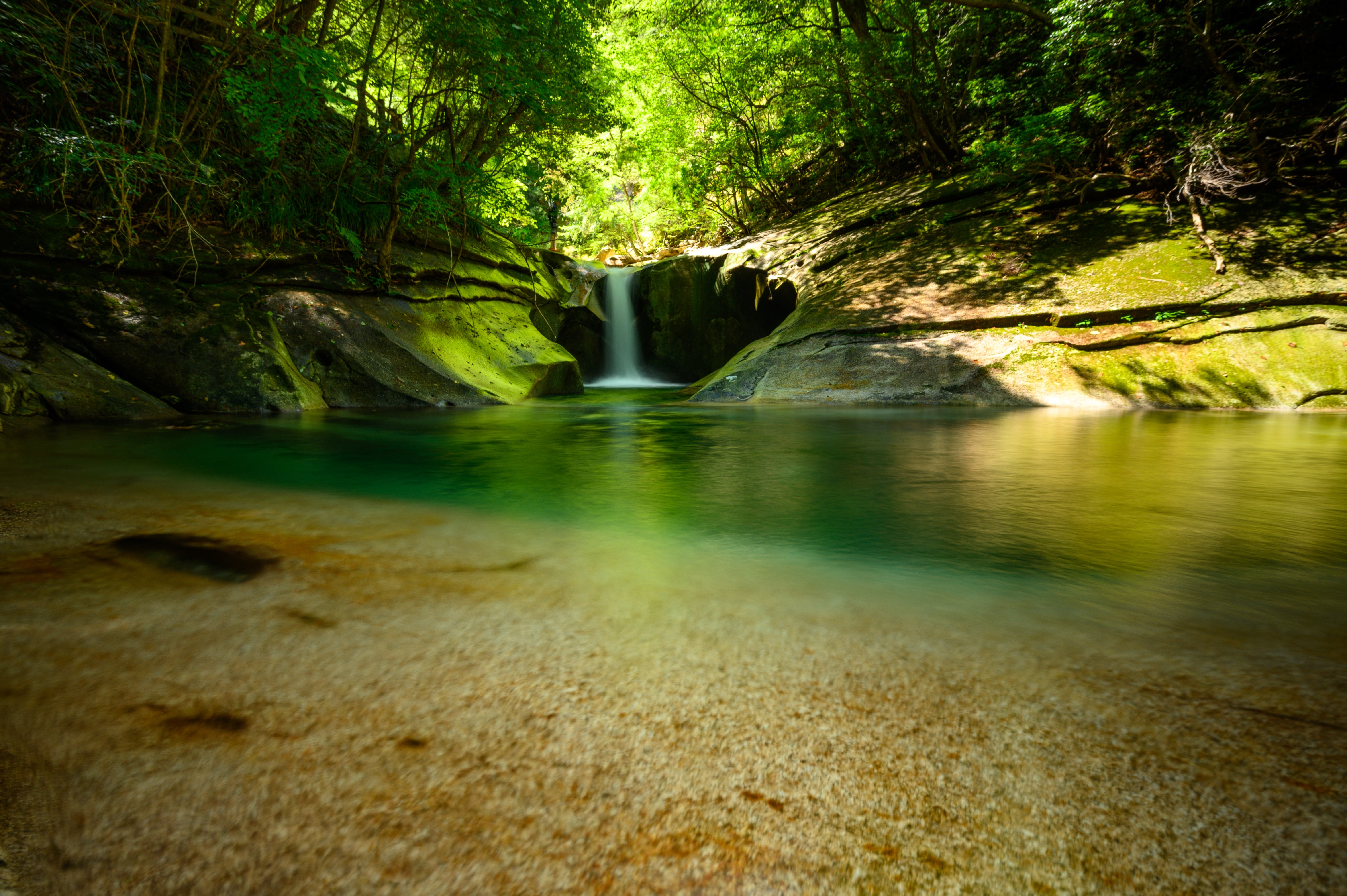 Waterfall in a Japanese forest with long exposure HD Wallpaper