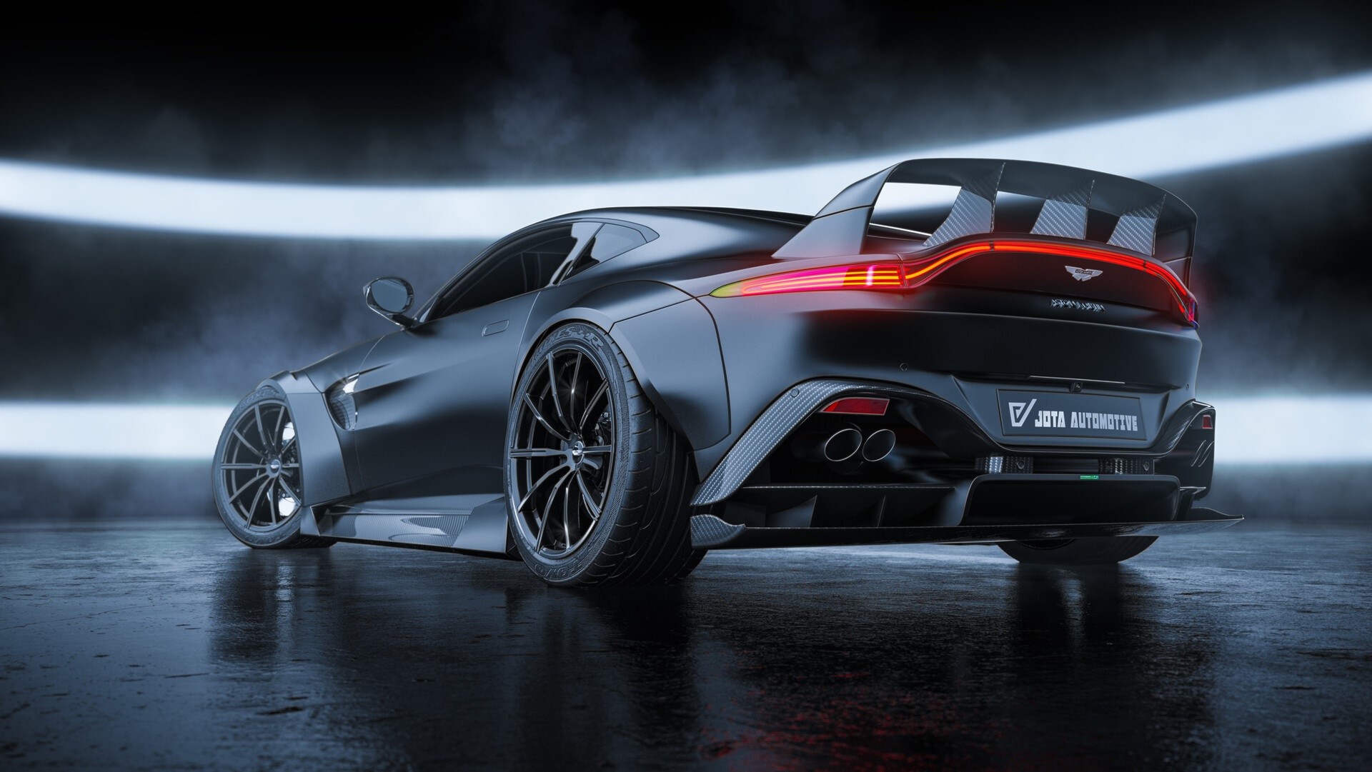 Black Aston Martin with a large rear spoiler HD Wallpaper