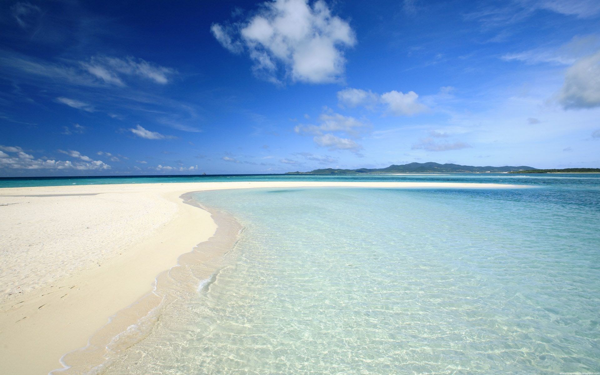 White sand beach and clear turquoise water under blue sky HD Wallpaper